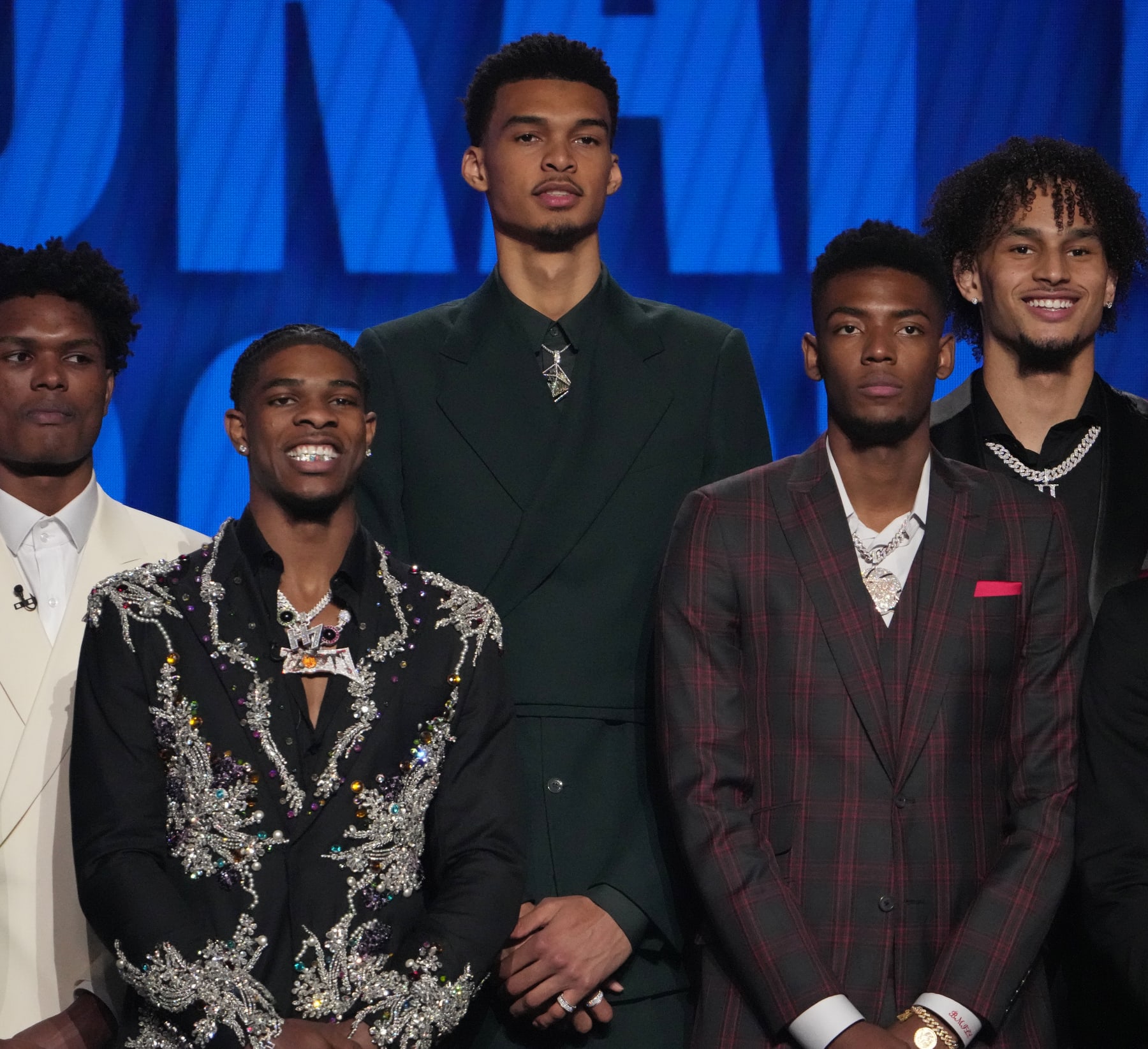 BROOKLYN, NY - JUNE 22: Victor Wembanyama, Scoot Henderson, and Brandon Miller look on during the 2023 NBA Draft on June 22, 2023 at Barclays Center in Brooklyn, New York. NOTE TO USER: User expressly acknowledges and agrees that, by downloading and or using this photograph, User is consenting to the terms and conditions of the Getty Images License Agreement. Mandatory Copyright Notice: Copyright 2023 NBAE (Photo by Jesse D. Garrabrant/NBAE via Getty Images)