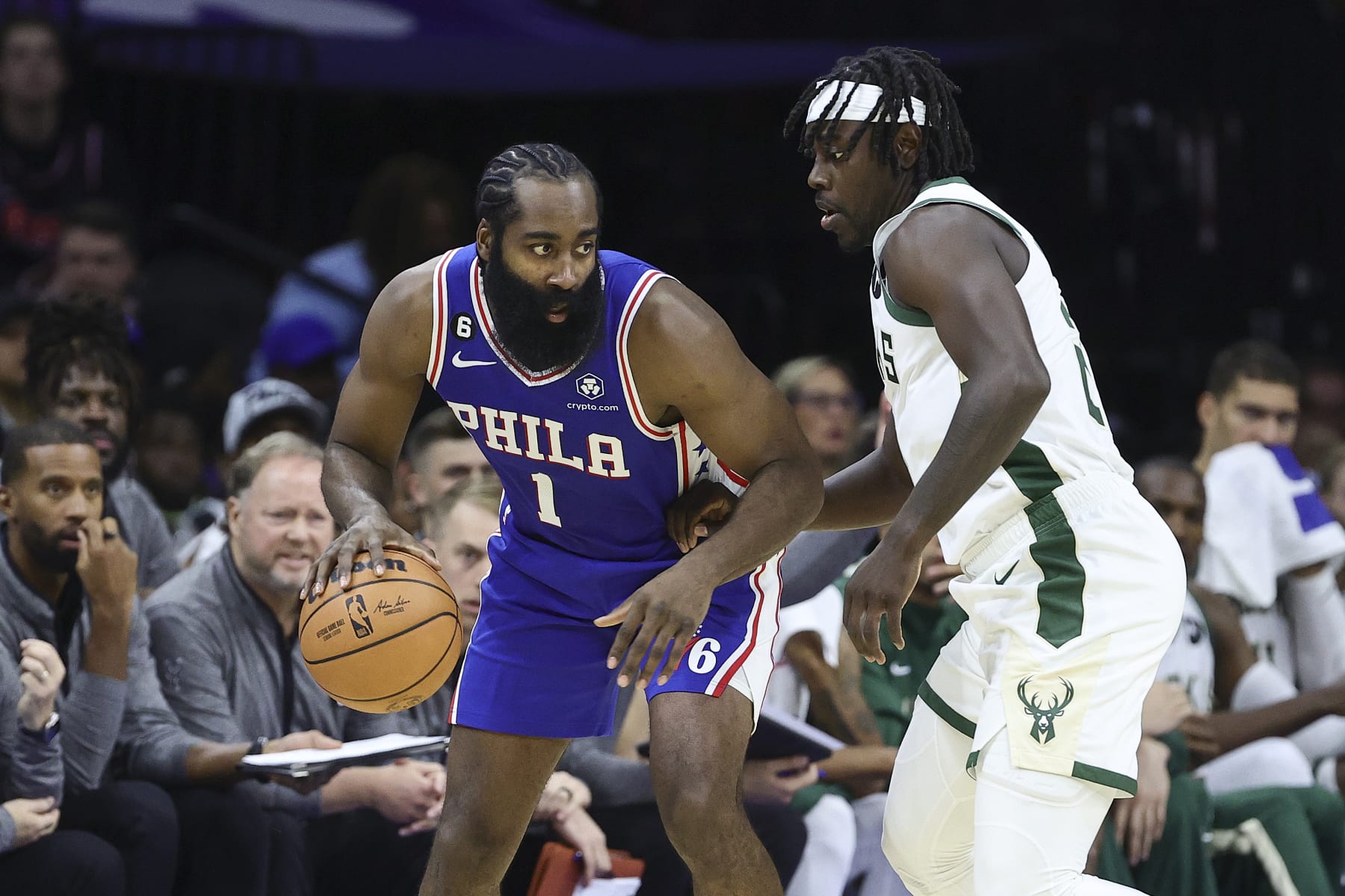PHILADELPHIA, PENNSYLVANIA - OCTOBER 20: James Harden #1 of the Philadelphia 76ers is guarded by Jrue Holiday #21 of the Milwaukee Bucks during the second quarter at Wells Fargo Center on October 20, 2022 in Philadelphia, Pennsylvania. NOTE TO USER: User expressly acknowledges and agrees that, by downloading and or using this photograph, User is consenting to the terms and conditions of the Getty Images License Agreement. (Photo by Tim Nwachukwu/Getty Images)