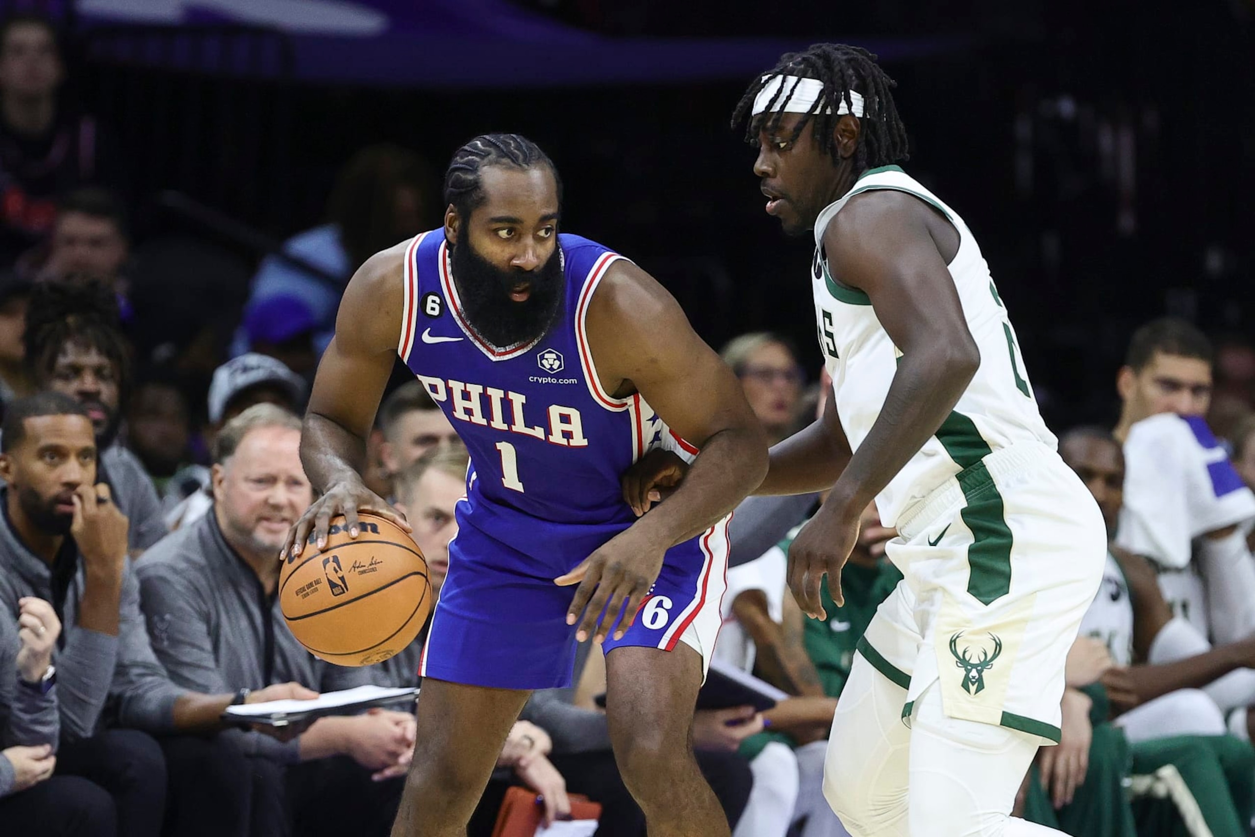 PHILADELPHIA, PENNSYLVANIA - OCTOBER 20: James Harden #1 of the Philadelphia 76ers is guarded by Jrue Holiday #21 of the Milwaukee Bucks during the second quarter at Wells Fargo Center on October 20, 2022 in Philadelphia, Pennsylvania. NOTE TO USER: User expressly acknowledges and agrees that, by downloading and or using this photograph, User is consenting to the terms and conditions of the Getty Images License Agreement. (Photo by Tim Nwachukwu/Getty Images)