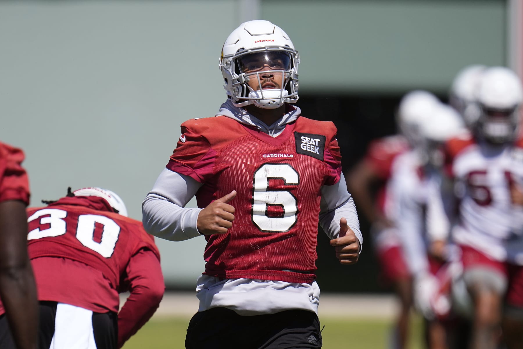 Arizona Cardinals running back James Conner warms up during mini camp practice at the team's NFL football training facility Tuesday, June 13, 2023, in Tempe, Ariz. (AP Photo/Ross D. Franklin)