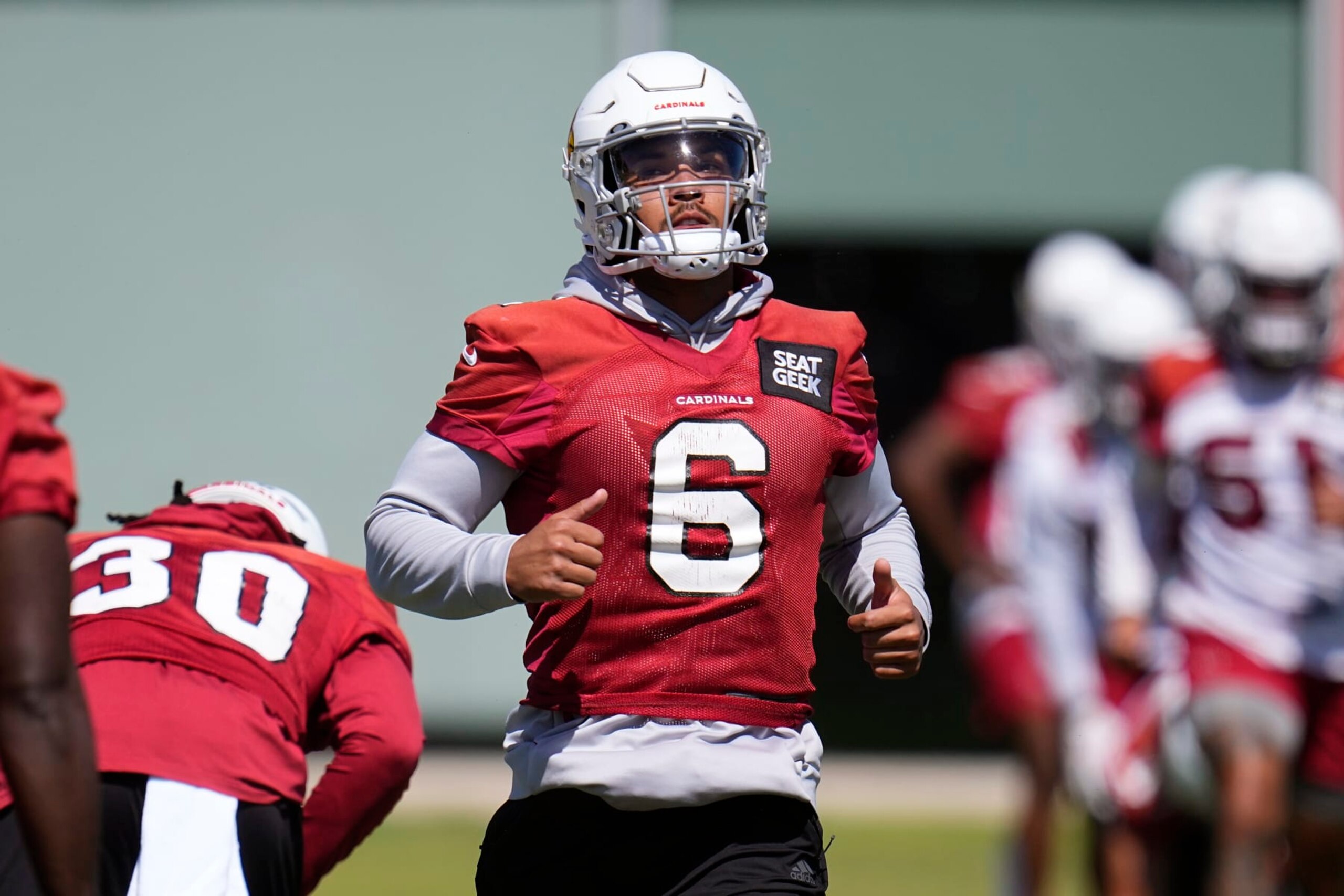 Arizona Cardinals running back James Conner warms up during mini camp practice at the team's NFL football training facility Tuesday, June 13, 2023, in Tempe, Ariz. (AP Photo/Ross D. Franklin)