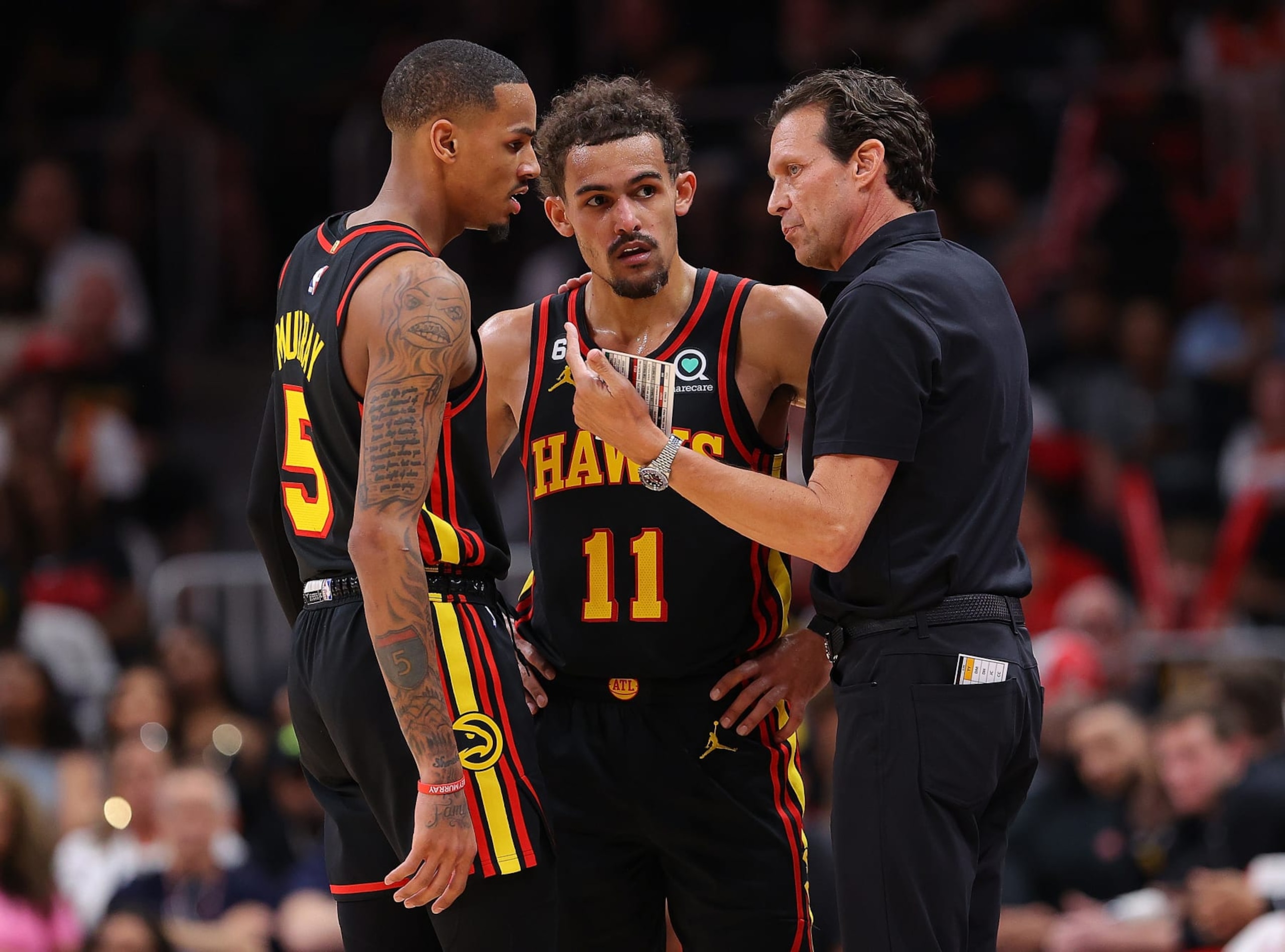 ATLANTA, GEORGIA - APRIL 21: Head coach Quin Snyder of the Atlanta Hawks converses with Trae Young #11 and Dejounte Murray #5 against the Boston Celtics during the fourth quarter of Game Three of the Eastern Conference First Round Playoffs at State Farm Arena on April 21, 2023 in Atlanta, Georgia. NOTE TO USER: User expressly acknowledges and agrees that, by downloading and or using this photograph, User is consenting to the terms and conditions of the Getty Images License Agreement. (Photo by Kevin C. Cox/Getty Images) ATLANTA, GEORGIA - APRIL 21: Head coach Quin Snyder of the Atlanta Hawks converses with Trae Young #11 and Dejounte Murray #5 against the Boston Celtics during the fourth quarter of Game Three of the Eastern Conference First Round Playoffs at State Farm Arena on April 21, 2023 in Atlanta, Georgia. NOTE TO USER: User expressly acknowledges and agrees that, by downloading and or using this photograph, User is consenting to the terms and conditions of the Getty Images License Agreement. (Photo by Kevin C. Cox/Getty Images)