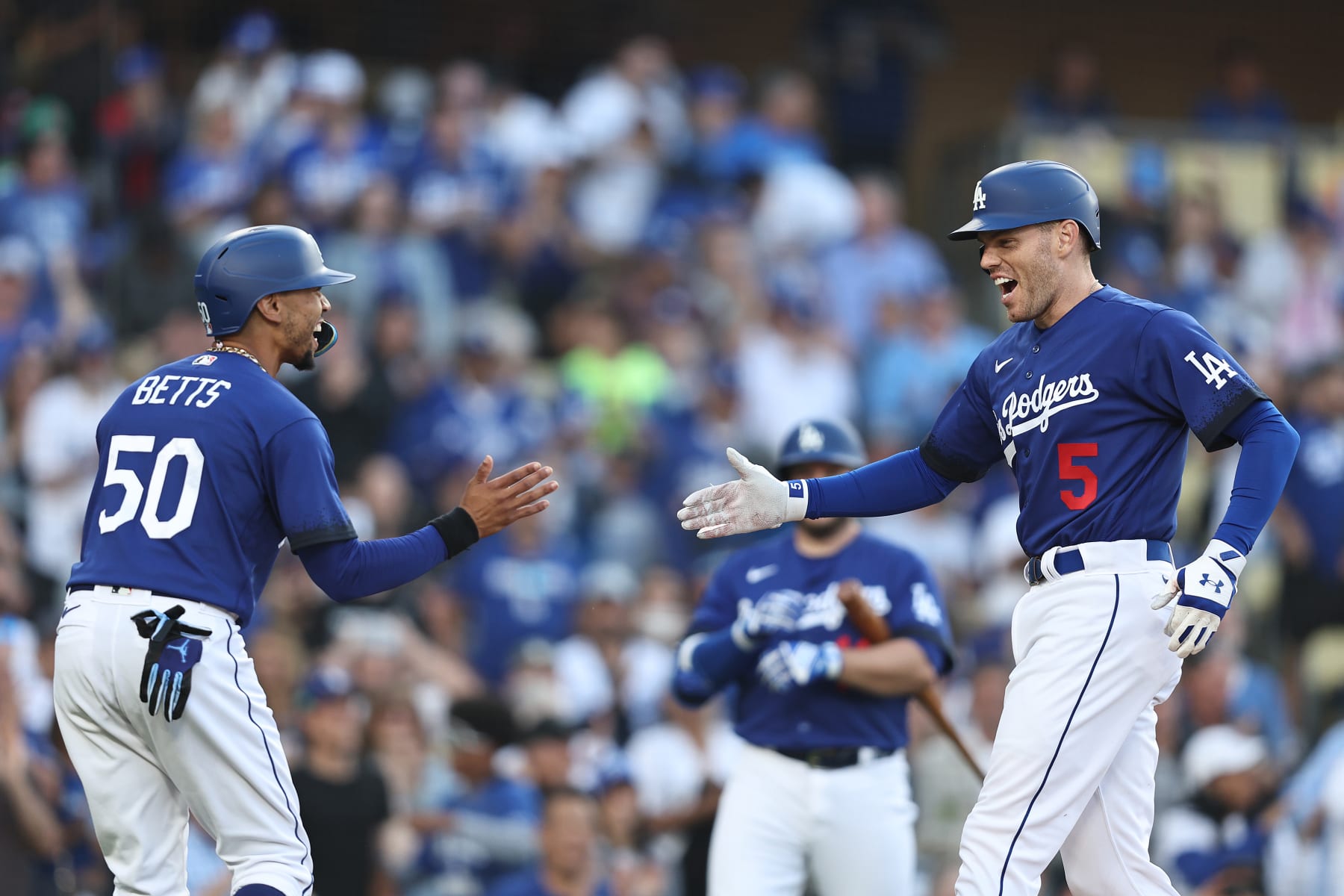 LOS ANGELES, CALIFORNIA - JULY 06: Freddie Freeman #5 of the Los Angeles Dodgers celebrates with teammate Mookie Betts #50 after hitting a two-run home run against the Pittsburgh Pirates during the first inning at Dodger Stadium on July 06, 2023 in Los Angeles, California. (Photo by Michael Owens/Getty Images)
