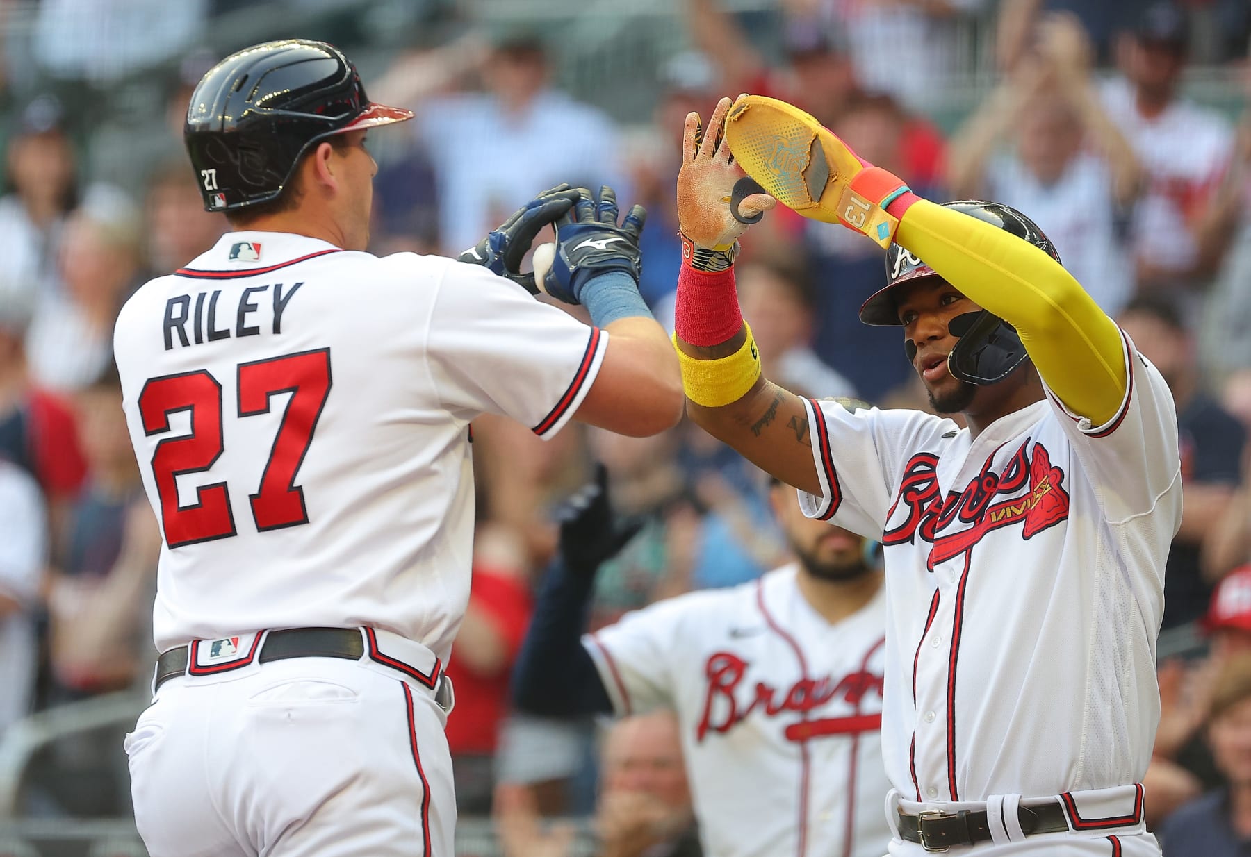 ATLANTA, GEORGIA - JUNE 08: Austin Riley #27 of the Atlanta Braves reacts with Ronald Acuna Jr. #13 after hitting a two-run homer in the first inning against the New York Mets at Truist Park on June 08, 2023 in Atlanta, Georgia. (Photo by Kevin C. Cox/Getty Images) ATLANTA, GEORGIA - JUNE 08: Austin Riley #27 of the Atlanta Braves reacts with Ronald Acuna Jr. #13 after hitting a two-run homer in the first inning against the New York Mets at Truist Park on June 08, 2023 in Atlanta, Georgia. (Photo by Kevin C. Cox/Getty Images)