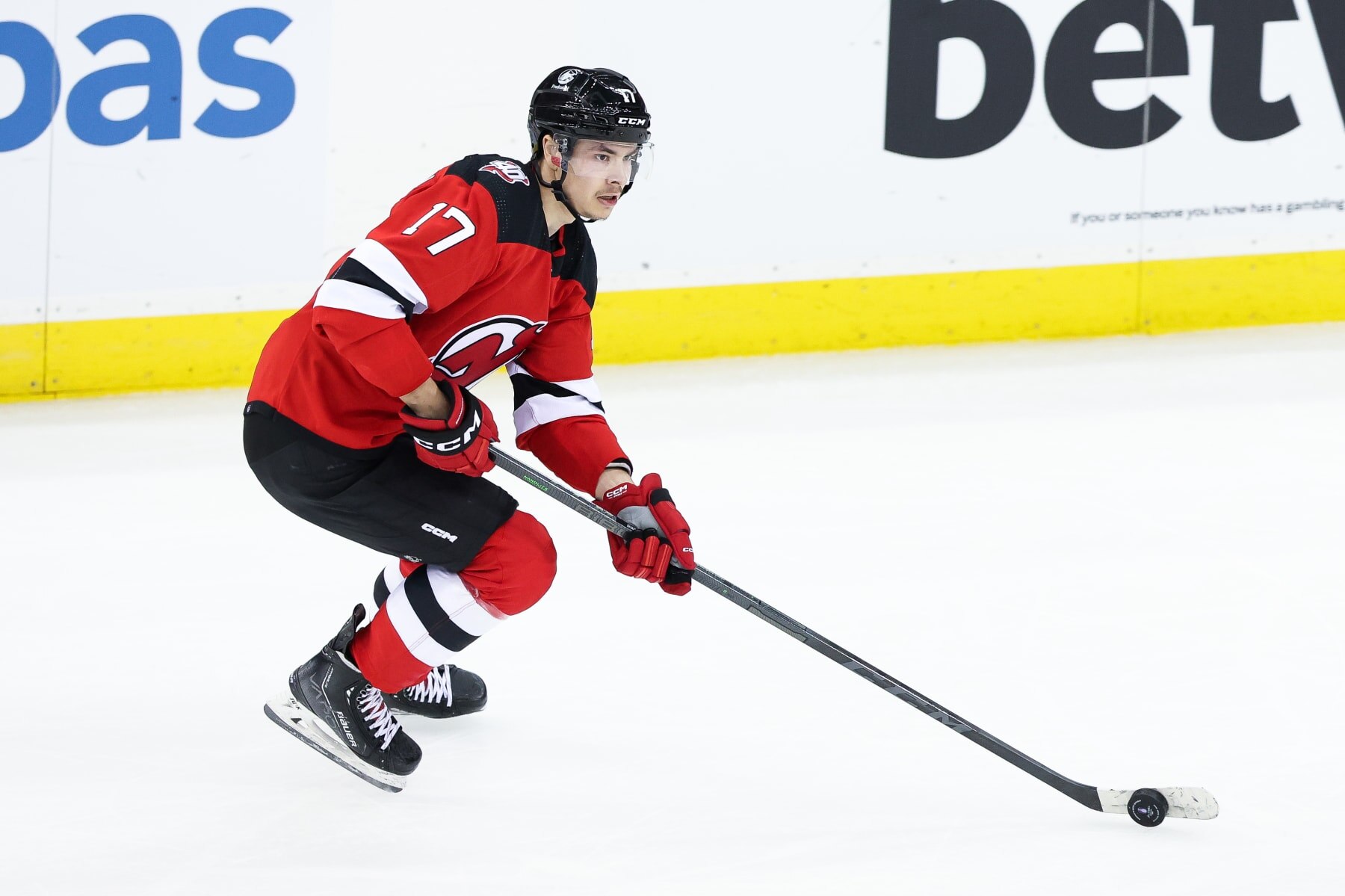 NEWARK, NJ - MAY 01: New Jersey Devils center Yegor Sharangovich (17) skates with the puck during Game 7 of an Eastern Conference First Round playoff game between the New York Rangers and the New Jersey Devils on May 1, 2023, at Prudential Center in Newark, New Jersey. (Photo by Andrew Mordzynski/Icon Sportswire via Getty Images)