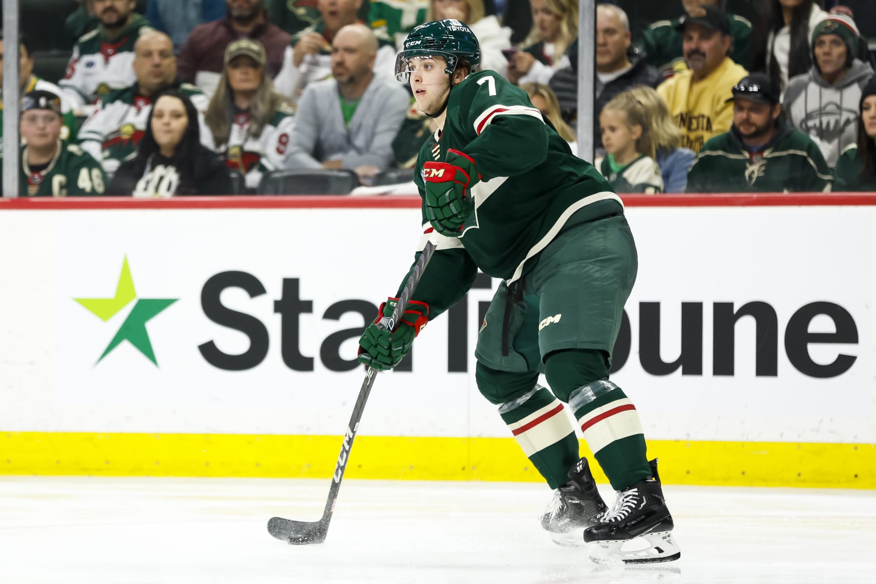 ST PAUL, MN - APRIL 28: Brock Faber #7 of the Minnesota Wild passes the puck against the Dallas Stars in the second period in Game Six of the First Round of the 2023 Stanley Cup Playoffs at Xcel Energy Center on April 28, 2023 in St Paul, Minnesota. The Stars defeated the Wild 4-1 to advance to the Second Round. (Photo by David Berding/Getty Images)