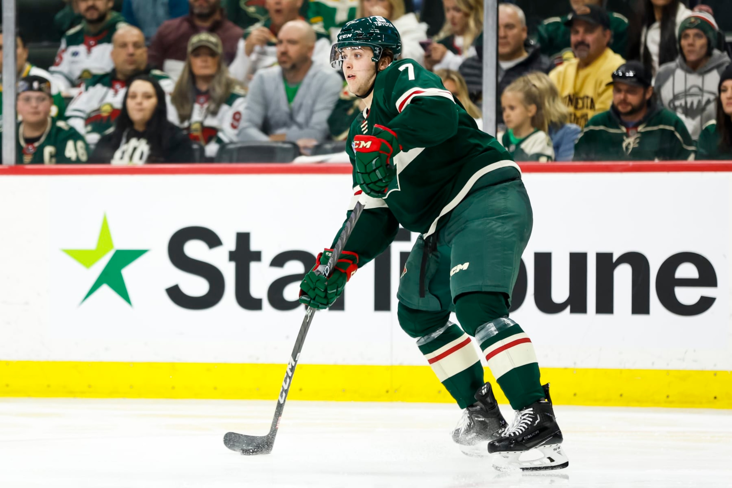 ST PAUL, MN - APRIL 28: Brock Faber #7 of the Minnesota Wild passes the puck against the Dallas Stars in the second period in Game Six of the First Round of the 2023 Stanley Cup Playoffs at Xcel Energy Center on April 28, 2023 in St Paul, Minnesota. The Stars defeated the Wild 4-1 to advance to the Second Round. (Photo by David Berding/Getty Images)