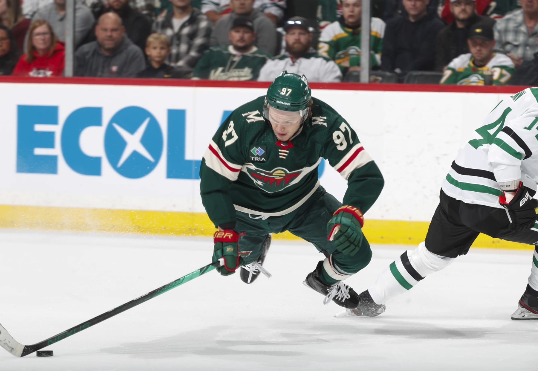 ST PAUL, MN - APRIL 28: Kirill Kaprizov #97 of the Minnesota Wild is tripped up by Jamie Benn #14 of the Dallas Stars in the first period of Game Six of the First Round of the 2023 Stanley Cup Playoffs at Xcel Energy Center on April 28, 2023 in St Paul, Minnesota. (Photo by Bruce Kluckhohn/NHLI via Getty Images)