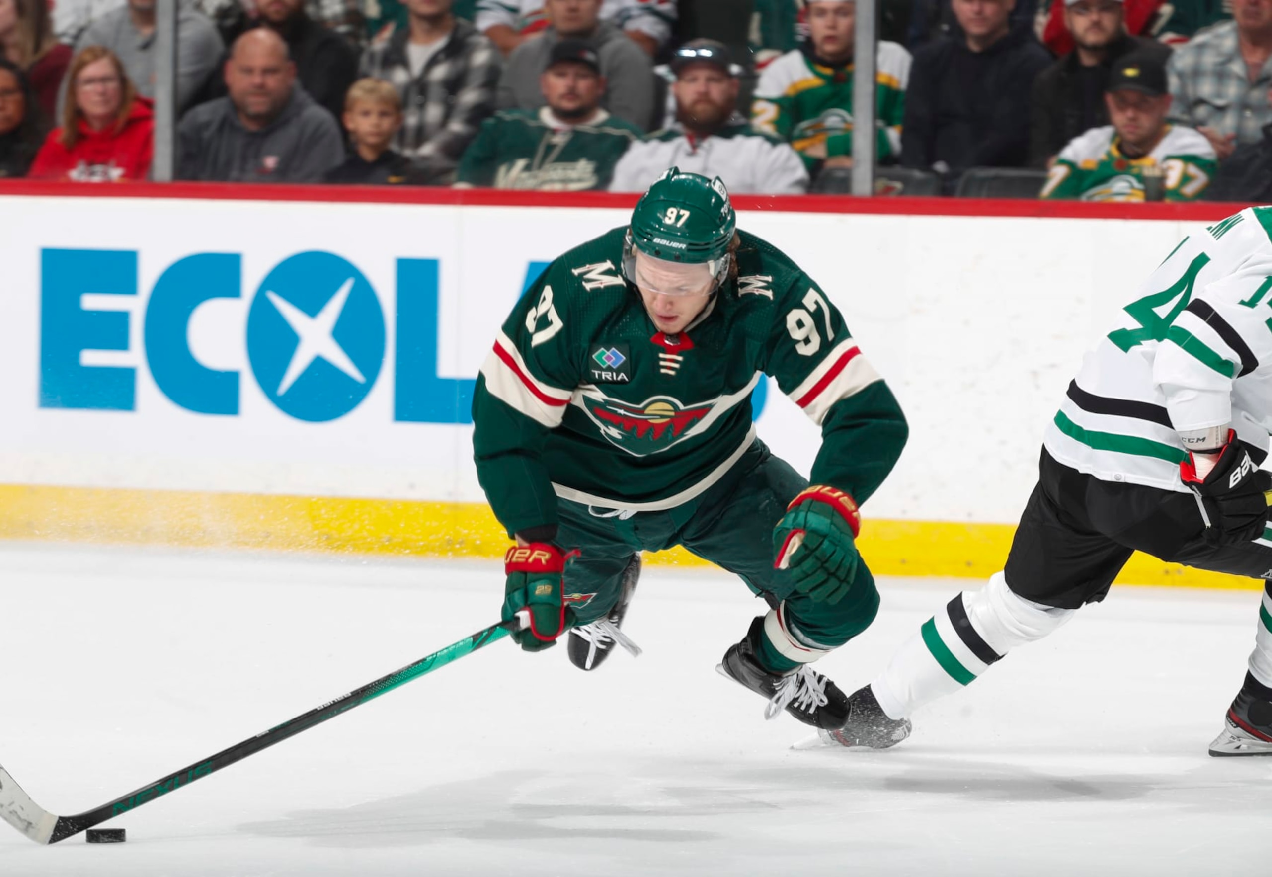 ST PAUL, MN - APRIL 28: Kirill Kaprizov #97 of the Minnesota Wild is tripped up by Jamie Benn #14 of the Dallas Stars in the first period of Game Six of the First Round of the 2023 Stanley Cup Playoffs at Xcel Energy Center on April 28, 2023 in St Paul, Minnesota. (Photo by Bruce Kluckhohn/NHLI via Getty Images)