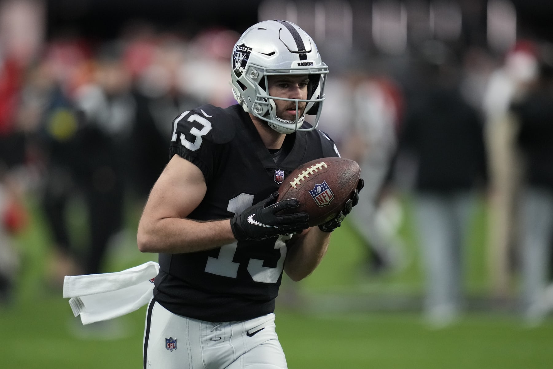 Las Vegas Raiders wide receiver Hunter Renfrow (13) warms up before an NFL football game against the Kansas City Chiefs, Wednesday, Jan. 11, 2023, in Las Vegas. (AP Photo/John Locher)