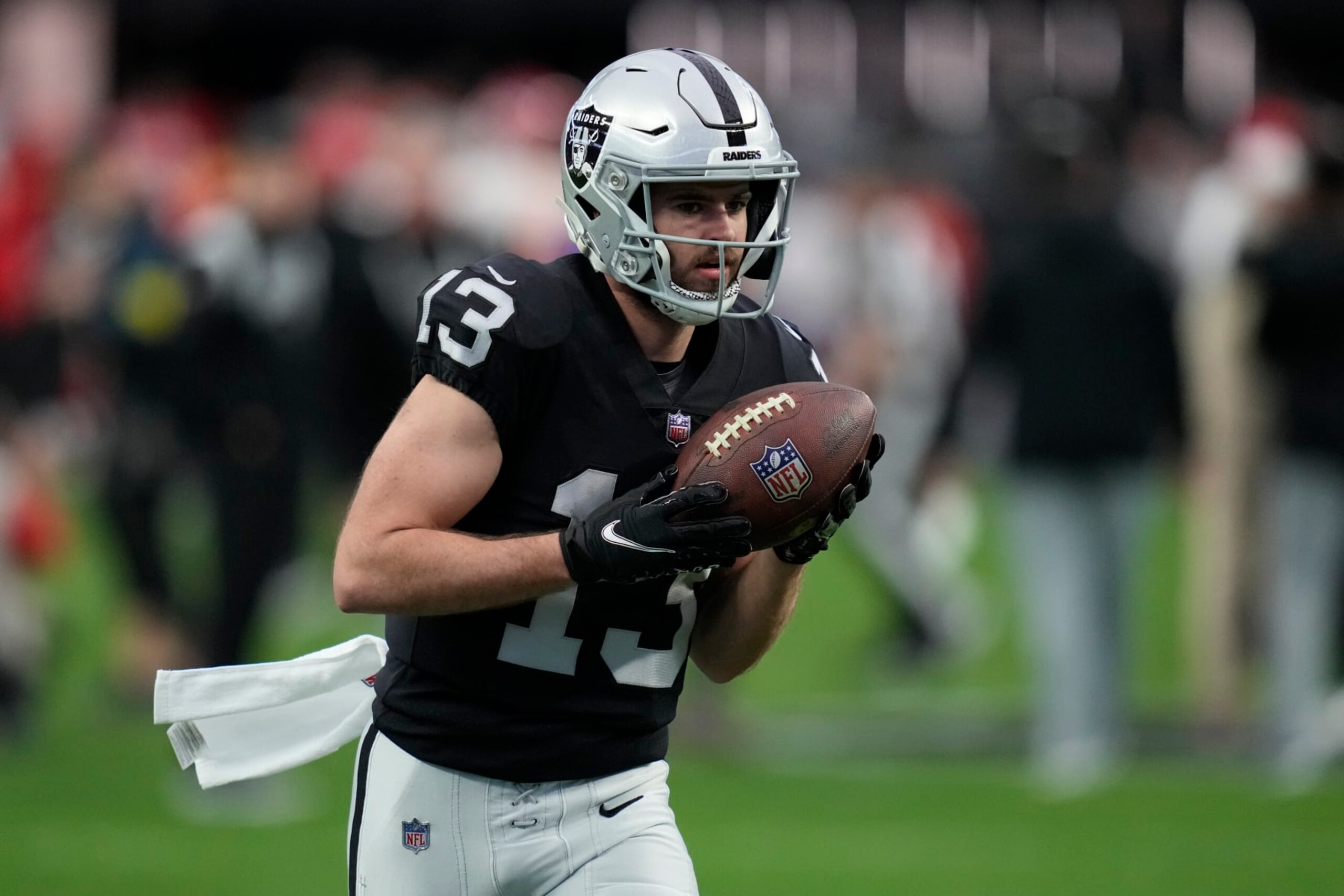 Las Vegas Raiders wide receiver Hunter Renfrow (13) warms up before an NFL football game against the Kansas City Chiefs, Wednesday, Jan. 11, 2023, in Las Vegas. (AP Photo/John Locher)