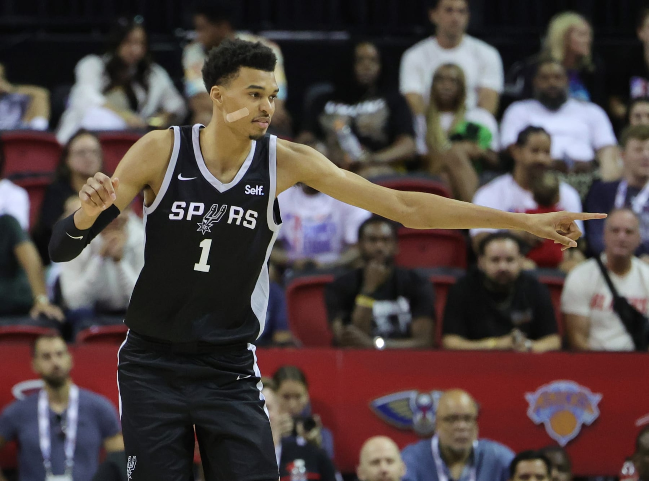 LAS VEGAS, NEVADA - JULY 09: Victor Wembanyama #1 of the San Antonio Spurs gestures to a teammate as they run back on defense against the Portland Trail Blazers in the second half of a 2023 NBA Summer League game at the Thomas & Mack Center on July 09, 2023 in Las Vegas, Nevada. NOTE TO USER: User expressly acknowledges and agrees that, by downloading and or using this photograph, User is consenting to the terms and conditions of the Getty Images License Agreement. (Photo by Ethan Miller/Getty Images) LAS VEGAS, NEVADA - JULY 09: Victor Wembanyama #1 of the San Antonio Spurs gestures to a teammate as they run back on defense against the Portland Trail Blazers in the second half of a 2023 NBA Summer League game at the Thomas & Mack Center on July 09, 2023 in Las Vegas, Nevada. NOTE TO USER: User expressly acknowledges and agrees that, by downloading and or using this photograph, User is consenting to the terms and conditions of the Getty Images License Agreement. (Photo by Ethan Miller/Getty Images)