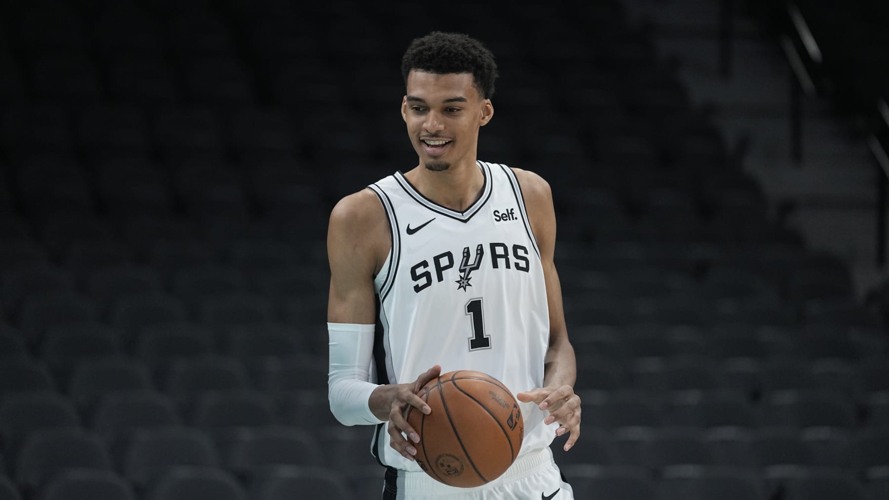 San Antonio Spurs NBA basketball first round draft pick Victor Wembanyama handles the ball following an introductory news conference in San Antonio, Saturday, June 24, 2023. (AP Photo/Eric Gay)