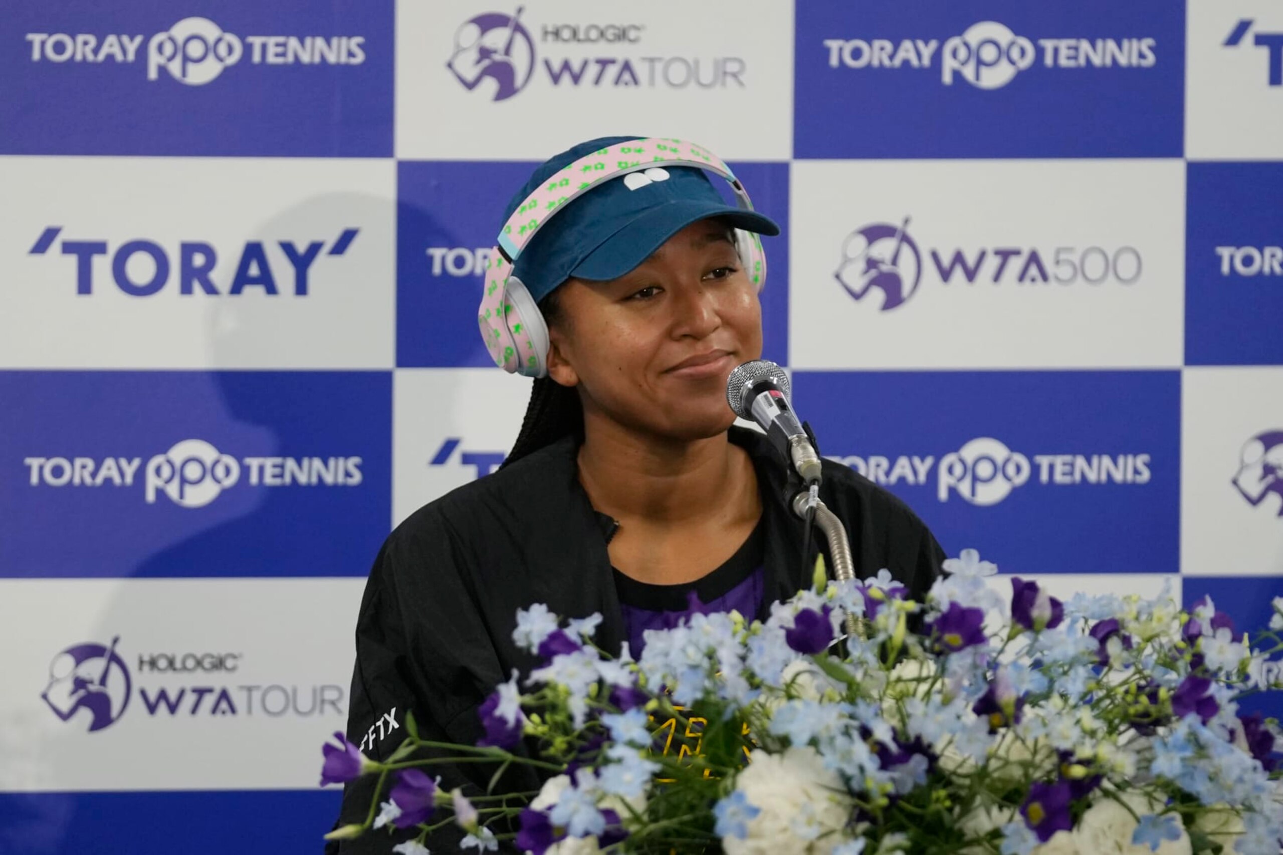 Naomi Osaka of Japan listens to a question during a news conference at the Pan Pacific Open tennis tournament in Tokyo, Monday, Sept. 19, 2022. (AP Photo/Hiro Komae)