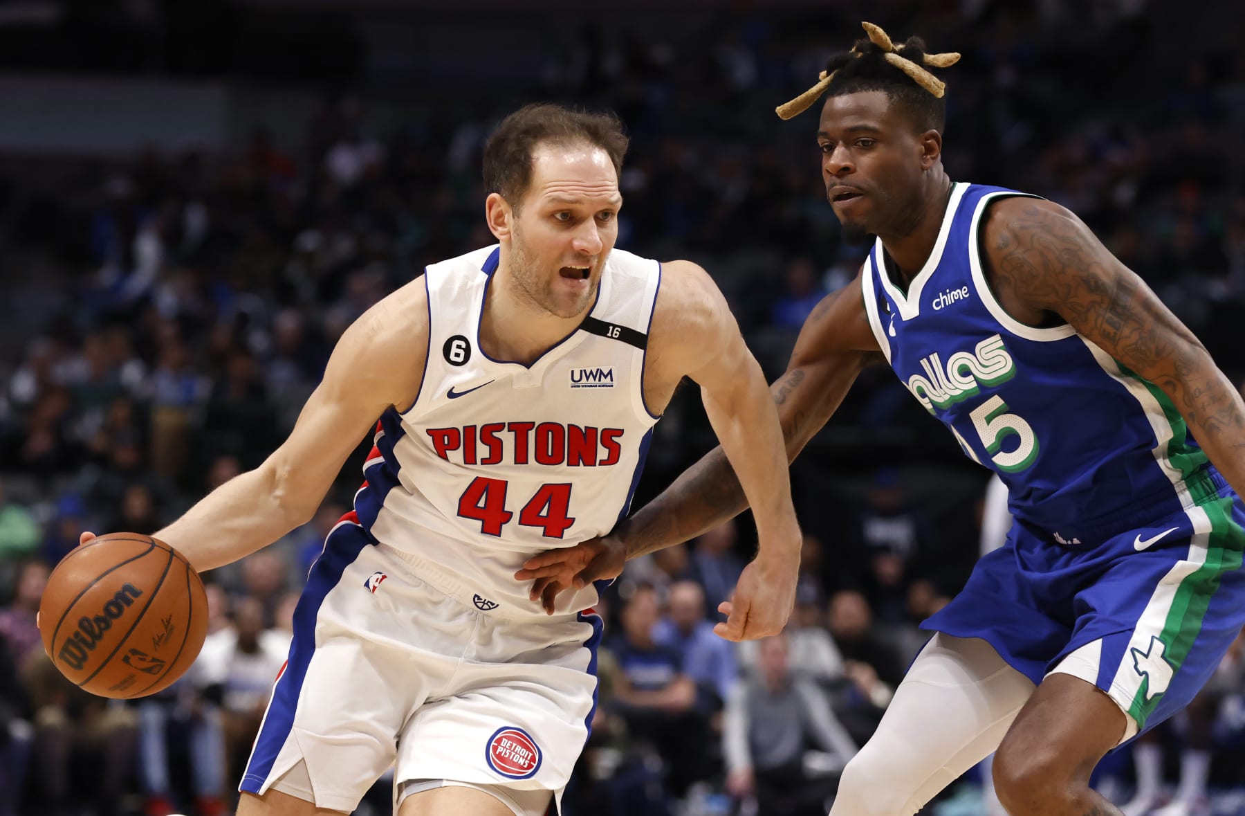 DALLAS, TX - JANUARY 30: Bojan Bogdanovic #44 of the Detroit Pistons drives against Reggie Bullock #25 of the Dallas Mavericks in the second half at American Airlines Center on January 30, 2023 in Dallas, Texas. The Mavericks won 111-105. NOTE TO USER: User expressly acknowledges and agrees that, by downloading and or using this photograph, User is consenting to the terms and conditions of the Getty Images License Agreement. (Photo by Ron Jenkins/Getty Images)