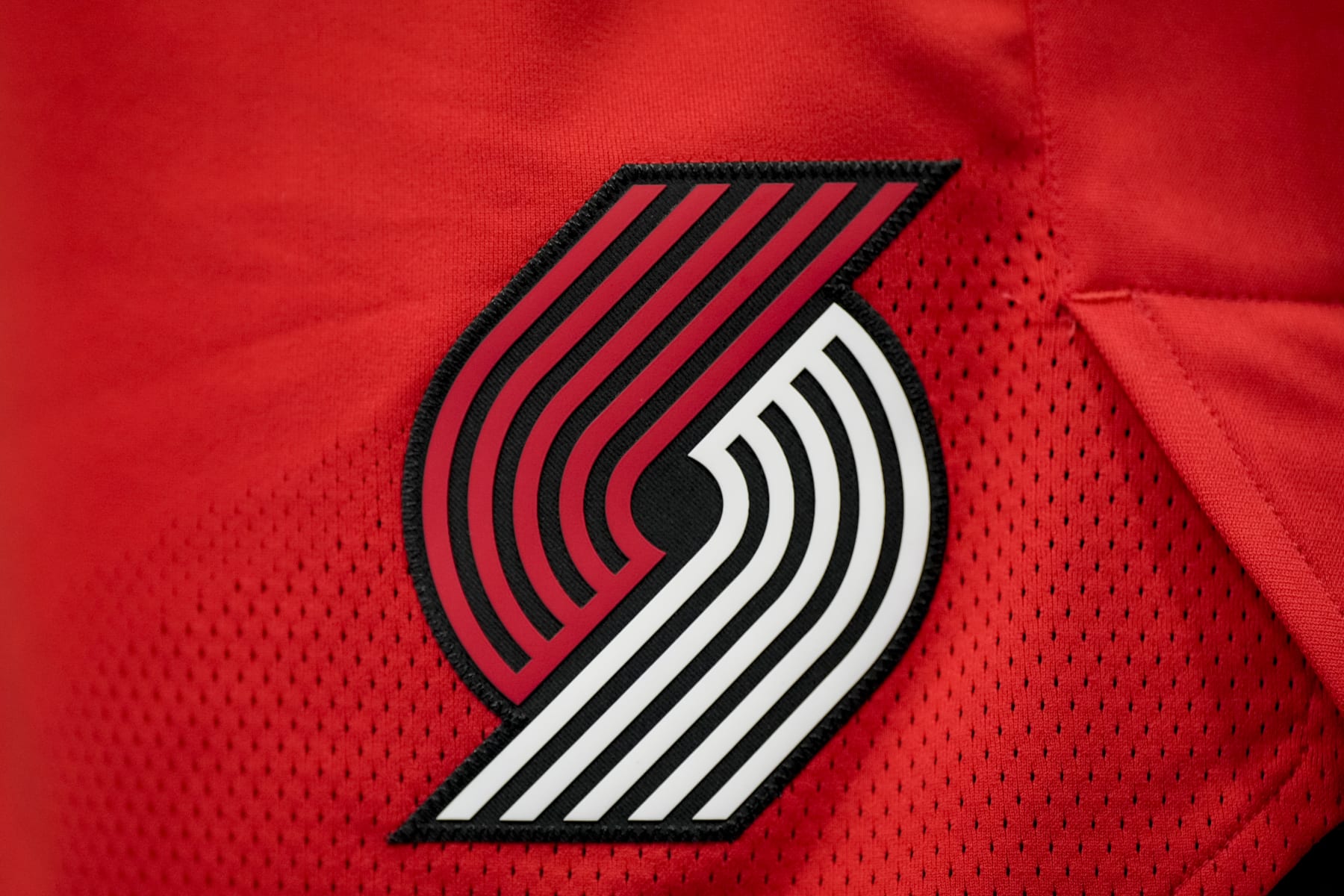 DETROIT, MICHIGAN - MARCH 21: The Portland Trail Blazers logo is pictured during the third quarter against the Detroit Pistons at Little Caesars Arena on March 21, 2022 in Detroit, Michigan. NOTE TO USER: User expressly acknowledges and agrees that, by downloading and or using this photograph, User is consenting to the terms and conditions of the Getty Images License Agreement. (Photo by Nic Antaya/Getty Images)