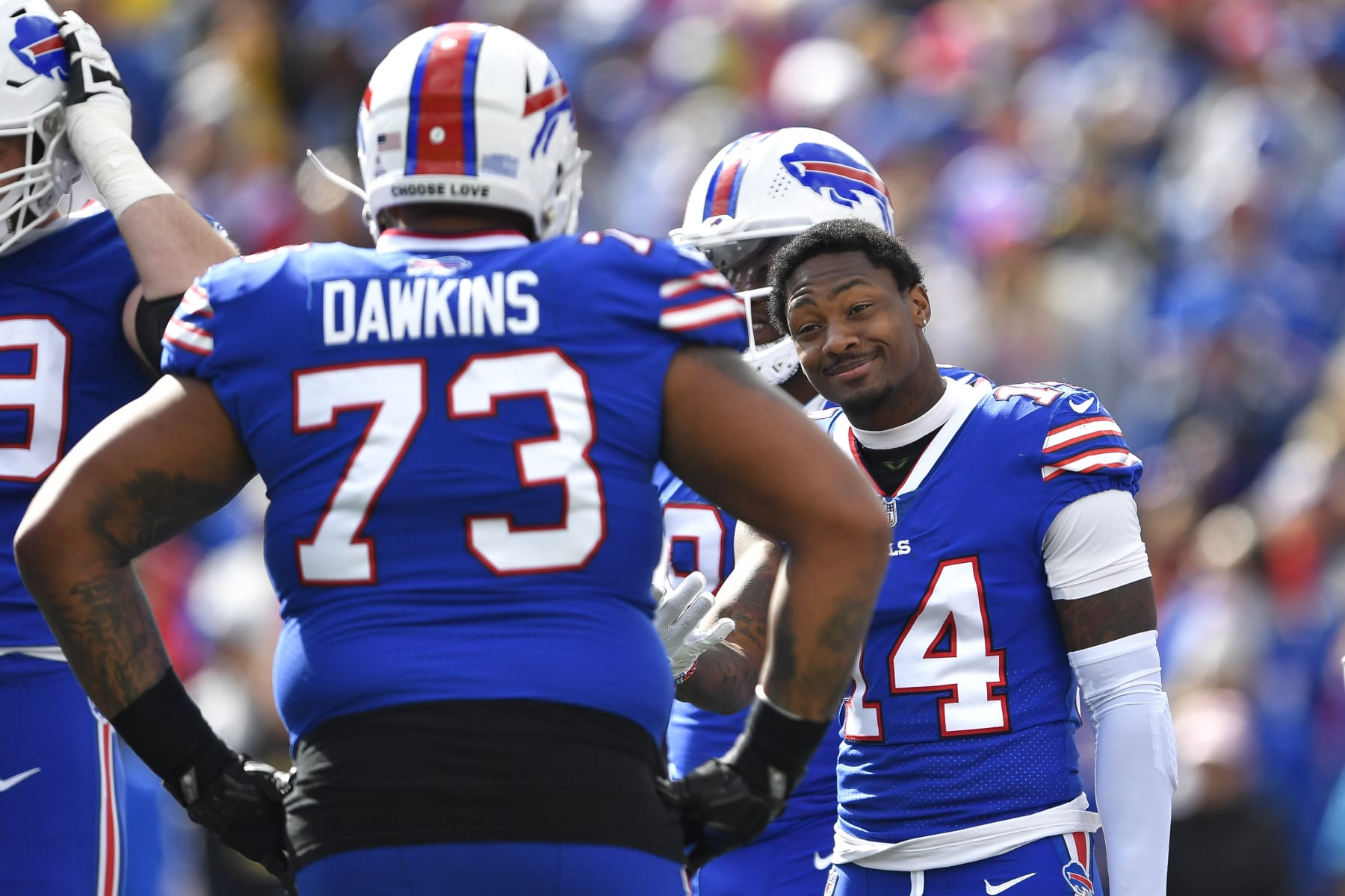 Buffalo Bills wide receiver Stefon Diggs (14) talks to tackle Dion Dawkins (73) during the first half of an NFL football game against the Pittsburgh Steelers in Orchard Park, N.Y., Sunday, Oct. 9, 2022. (AP Photo/Adrian Kraus)