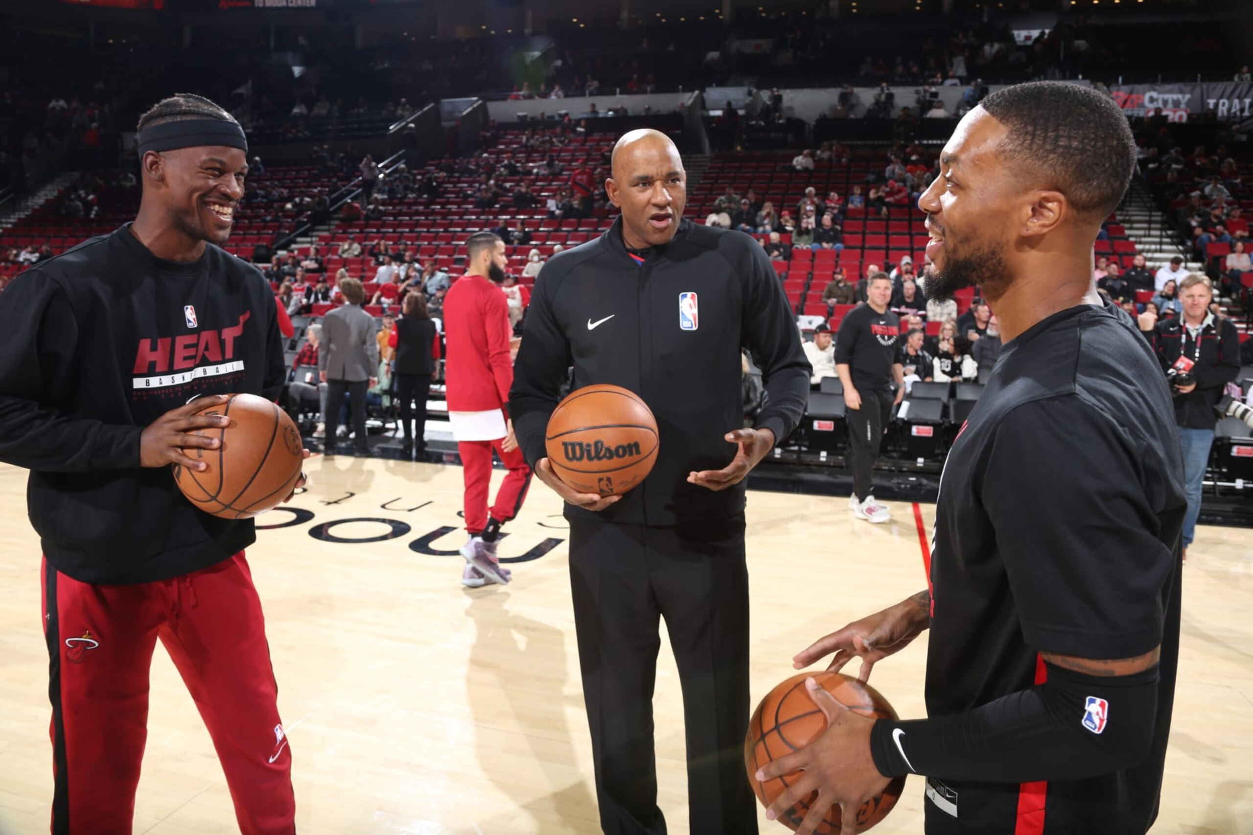 PORTLAND, OR - OCTOBER 26: Jimmy Butler #22 of the Miami Heat and Damian Lillard #0 of the Portland Trail Blazers smile before the game on October 26, 2022 at the Moda Center Arena in Portland, Oregon. NOTE TO USER: User expressly acknowledges and agrees that, by downloading and or using this photograph, user is consenting to the terms and conditions of the Getty Images License Agreement. Mandatory Copyright Notice: Copyright 2022 NBAE (Photo by Sam Forencich/NBAE via Getty Images) PORTLAND, OR - OCTOBER 26: Jimmy Butler #22 of the Miami Heat and Damian Lillard #0 of the Portland Trail Blazers smile before the game on October 26, 2022 at the Moda Center Arena in Portland, Oregon. NOTE TO USER: User expressly acknowledges and agrees that, by downloading and or using this photograph, user is consenting to the terms and conditions of the Getty Images License Agreement. Mandatory Copyright Notice: Copyright 2022 NBAE (Photo by Sam Forencich/NBAE via Getty Images)