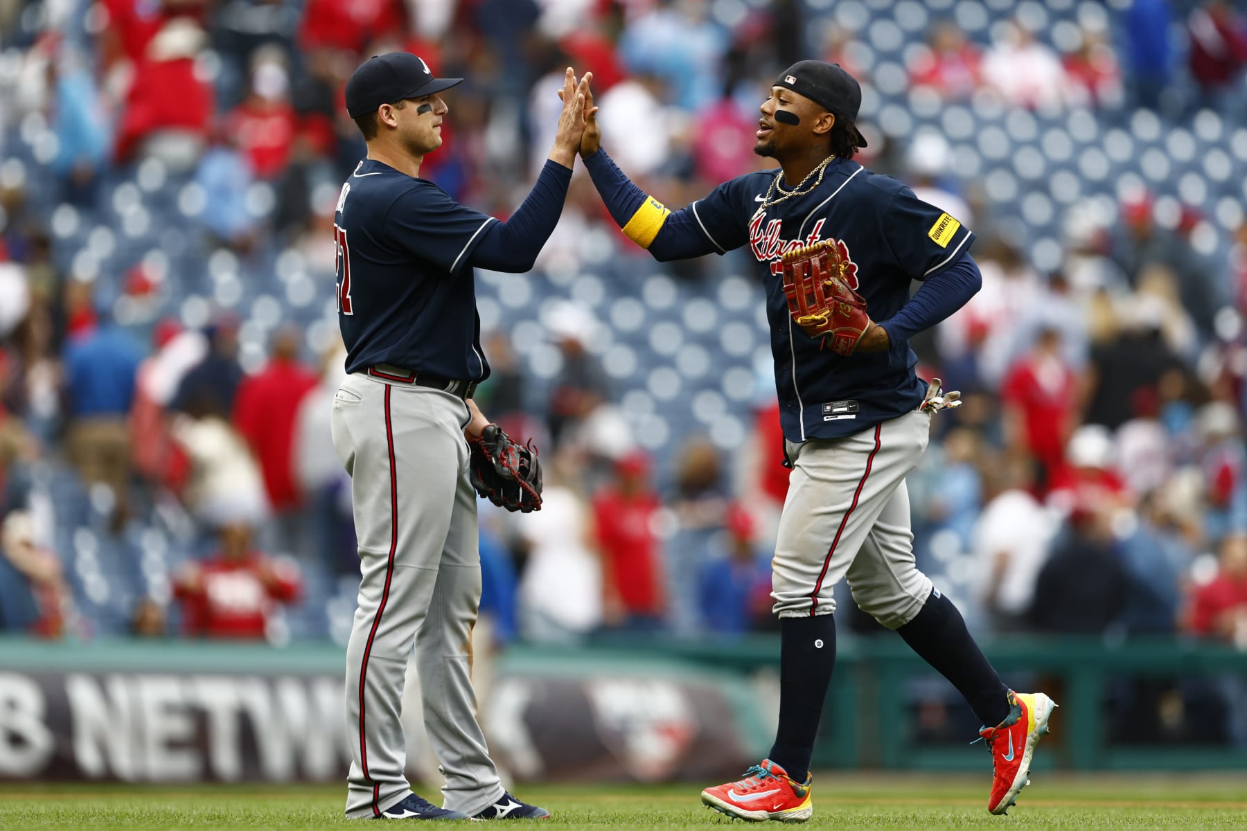 PHILADELPHIA, PENNSYLVANIA - JUNE 22: Austin Riley #27 and Ronald Acuna Jr. #13 of the Atlanta Braves celebrate their 5-1 win over the Philadelphia Phillies in a 10 inning game at Citizens Bank Park on June 22, 2023 in Philadelphia, Pennsylvania. (Photo by Rich Schultz/Getty Images)