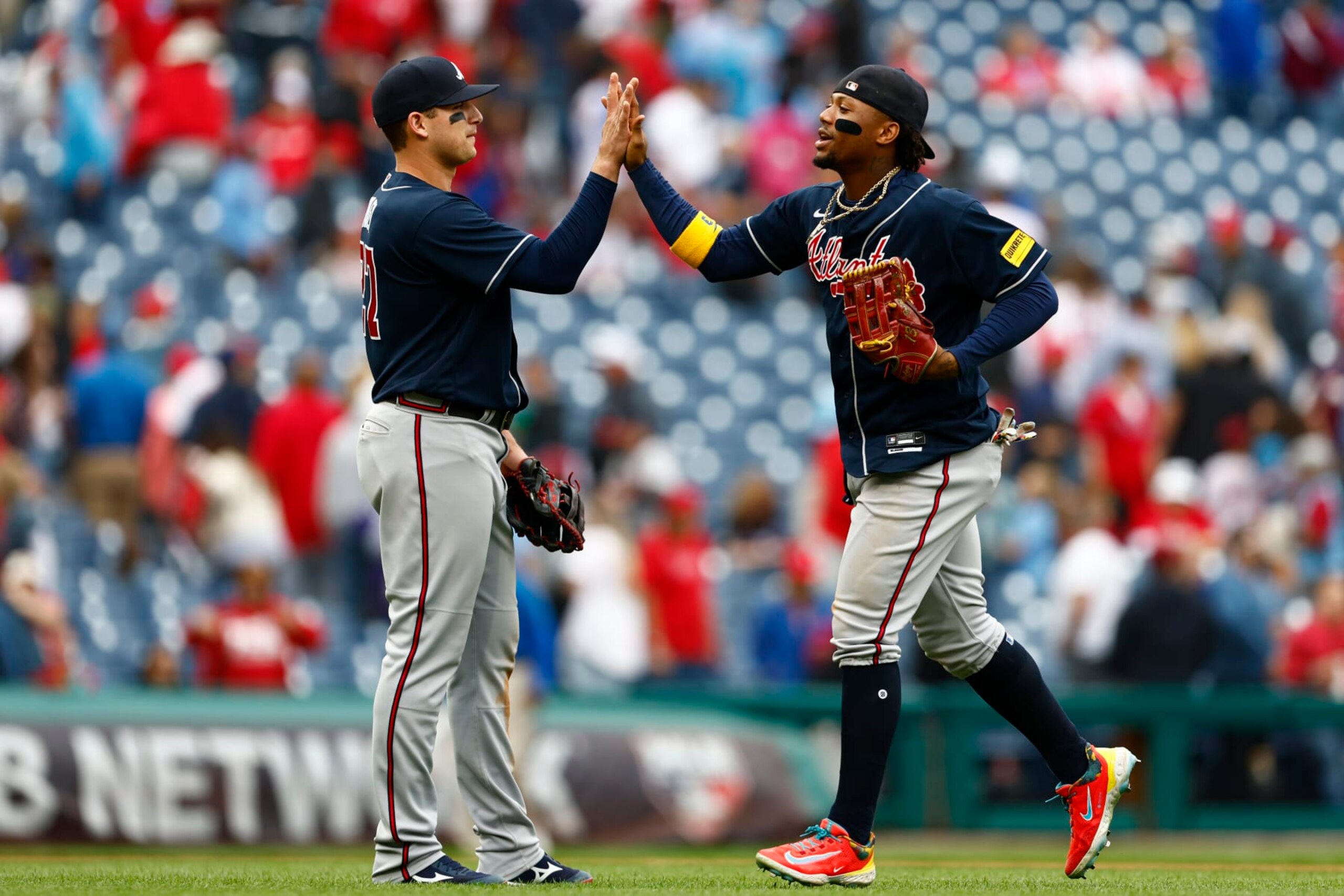 PHILADELPHIA, PENNSYLVANIA - JUNE 22: Austin Riley #27 and Ronald Acuna Jr. #13 of the Atlanta Braves celebrate their 5-1 win over the Philadelphia Phillies in a 10 inning game at Citizens Bank Park on June 22, 2023 in Philadelphia, Pennsylvania. (Photo by Rich Schultz/Getty Images)