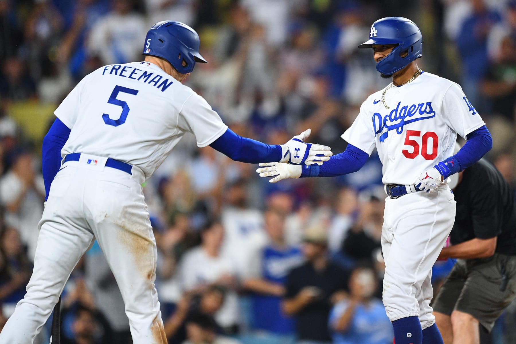 LOS ANGELES, CA - JULY 07: Los Angeles Dodgers second baseman Mookie Betts (50) is greeted by Los Angeles Dodgers first baseman Freddie Freeman (5) after his second home run in the MLB game between the Los Angeles Angels and the Los Angeles Dodgers on July 7, 2023 at Dodger Stadium in Los Angeles, CA. (Photo by Brian Rothmuller/Icon Sportswire via Getty Images)