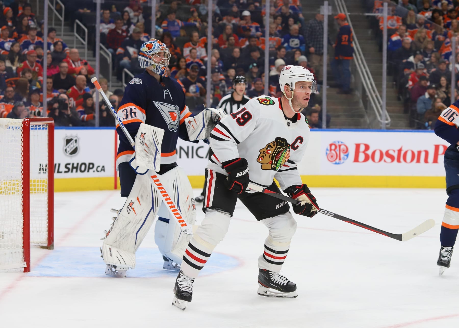 EDMONTON, CANADA - JANUARY 28: Jonathan Toews #19 of the Chicago Black Hawks waits for a shot from the point in the second period against the Edmonton Oilers on January 28, 2023 at Rogers Place in Edmonton, Alberta, Canada. (Photo by Lawrence Scott/Getty Images)