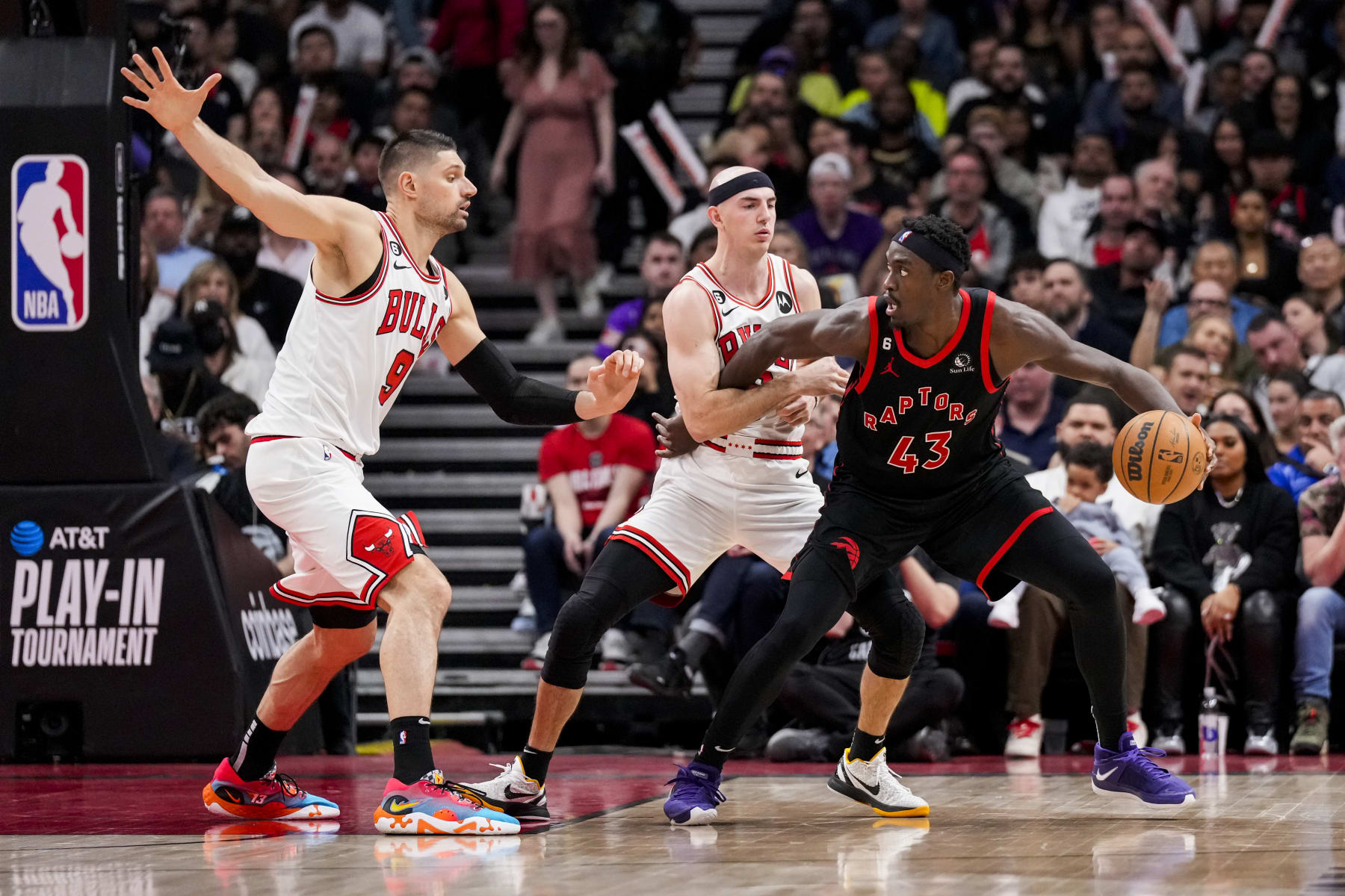 TORONTO, ON - APRIL 12: Pascal Siakam #43 of the Toronto Raptors battles against Nikola Vucevic #9 and Alex Caruso #6 of the Chicago Bulls during the 2023 Play-In Tournament at the Scotiabank Arena on April 12, 2023 in Toronto, Ontario, Canada. NOTE TO USER: User expressly acknowledges and agrees that, by downloading and/or using this Photograph, user is consenting to the terms and conditions of the Getty Images License Agreement. (Photo by Andrew Lahodynskyj/Getty Images)