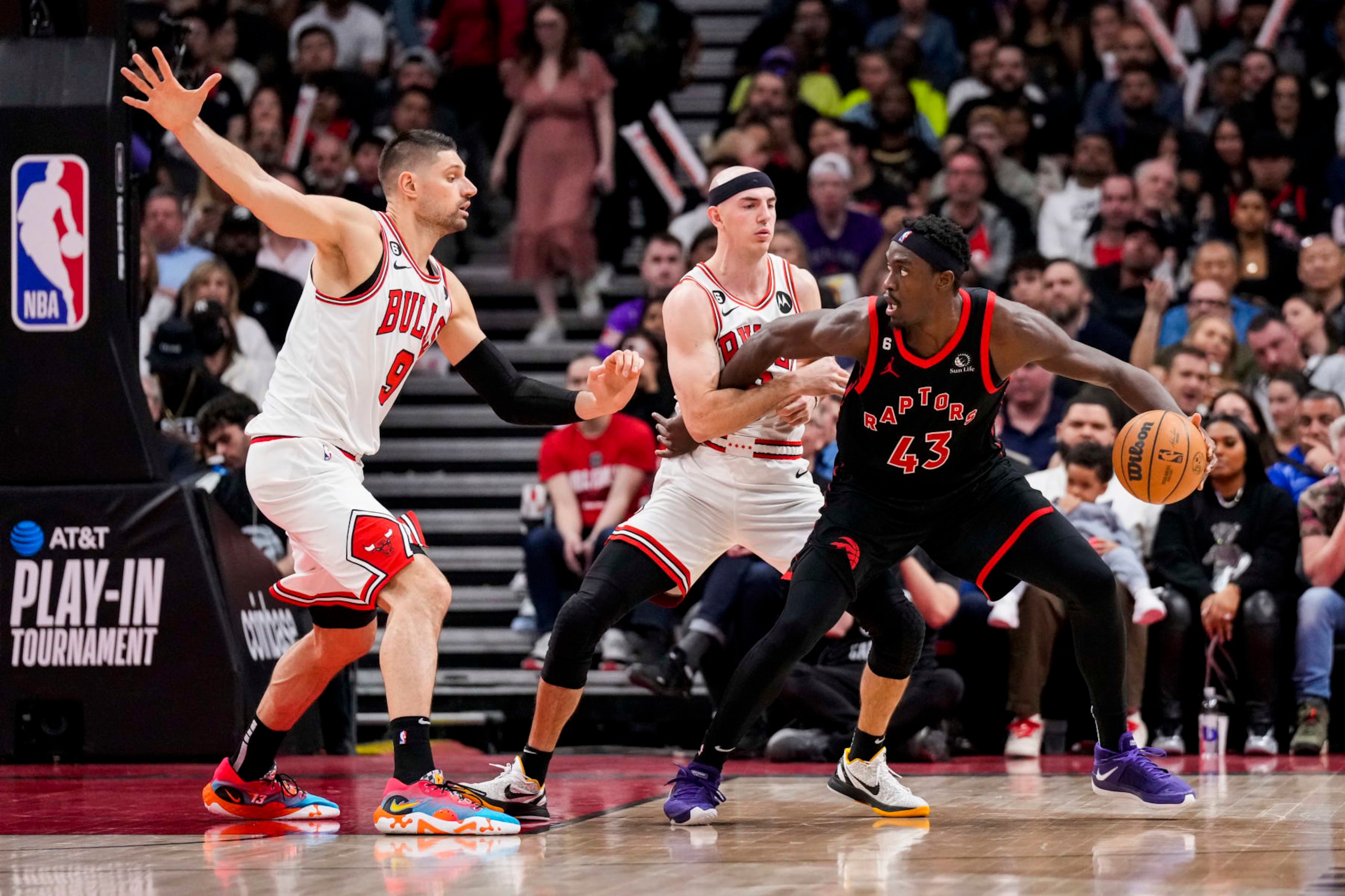 TORONTO, ON - APRIL 12: Pascal Siakam #43 of the Toronto Raptors battles against Nikola Vucevic #9 and Alex Caruso #6 of the Chicago Bulls during the 2023 Play-In Tournament at the Scotiabank Arena on April 12, 2023 in Toronto, Ontario, Canada. NOTE TO USER: User expressly acknowledges and agrees that, by downloading and/or using this Photograph, user is consenting to the terms and conditions of the Getty Images License Agreement. (Photo by Andrew Lahodynskyj/Getty Images)