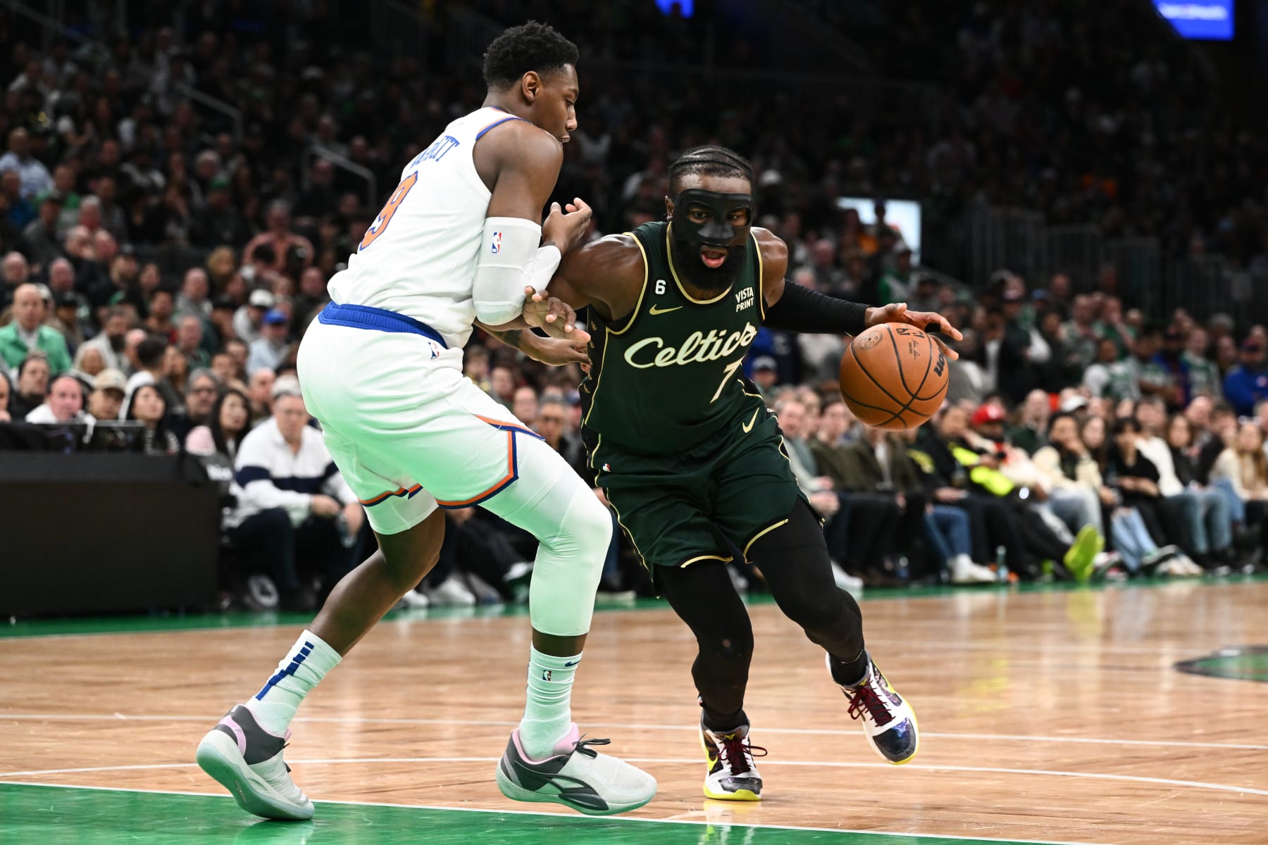 BOSTON, MASSACHUSETTS - MARCH 05: Jaylen Brown #7 of the Boston Celtics drives to the basket against RJ Barrett #9 of the New York Knicks during the fourth quarter at the TD Garden on March 05, 2023 in Boston, Massachusetts. NOTE TO USER: User expressly acknowledges and agrees that, by downloading and or using this photograph, User is consenting to the terms and conditions of the Getty Images License Agreement. (Photo by Brian Fluharty/Getty Images)