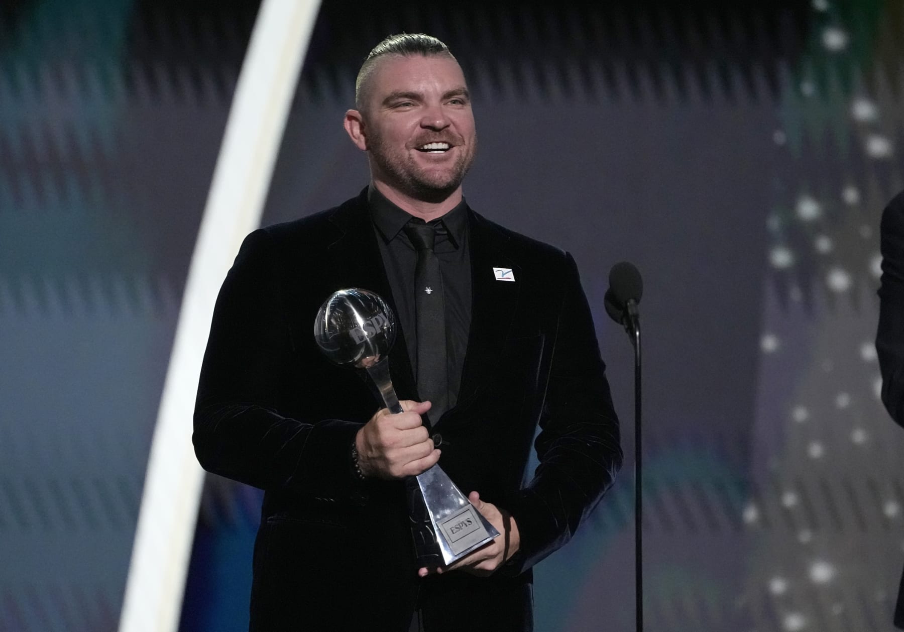 Professional MLB baseball player Liam Hendriks, of the Chicago White Sox, accepts the Jimmy V award for perseverance at the ESPY awards on Wednesday, July 12, 2023, at the Dolby Theatre in Los Angeles. (AP Photo/Mark Terrill)