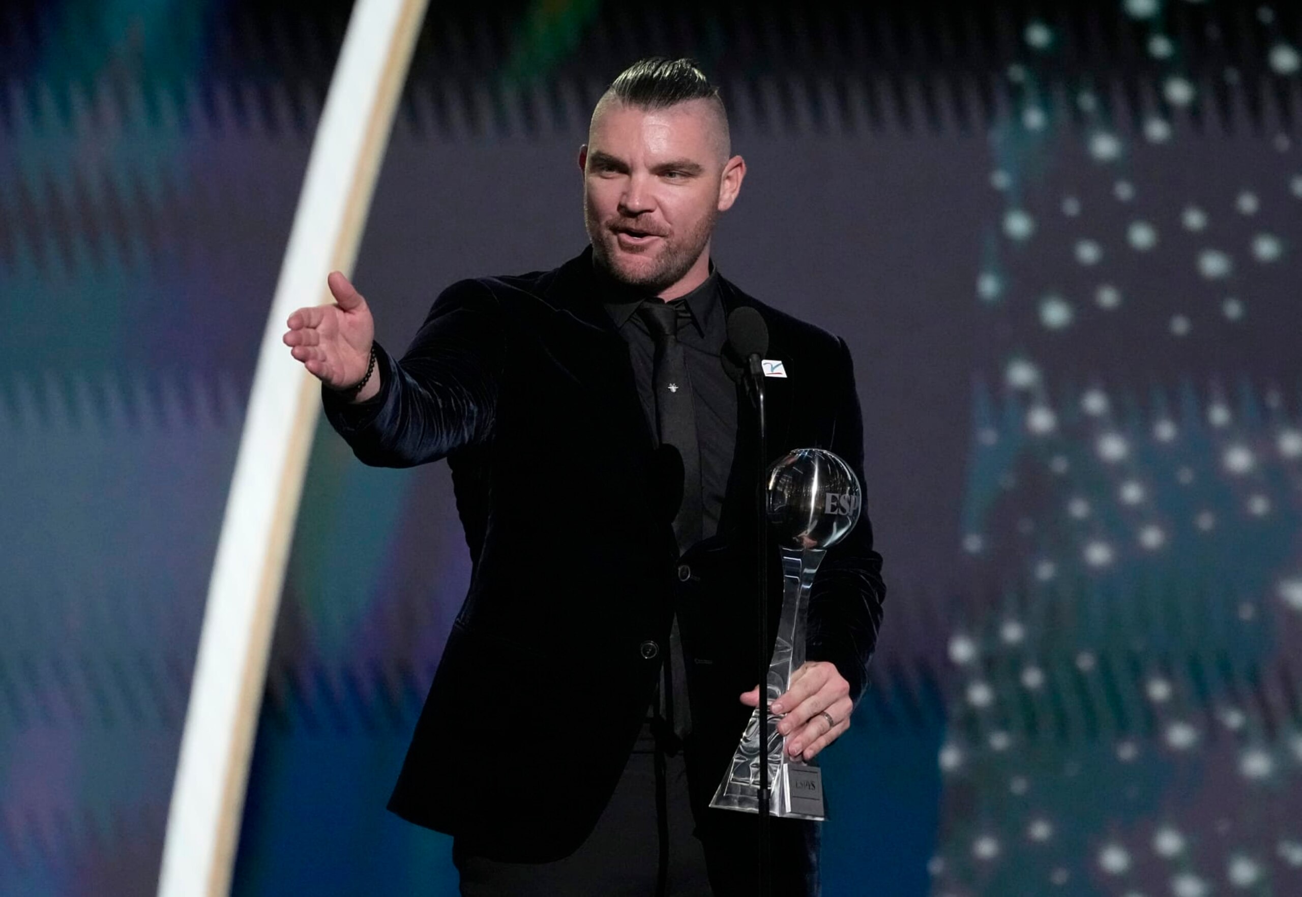Professional MLB baseball player Liam Hendriks, of the Chicago White Sox, accepts the Jimmy V award for perseverance at the ESPY awards on Wednesday, July 12, 2023, at the Dolby Theatre in Los Angeles. (AP Photo/Mark Terrill)