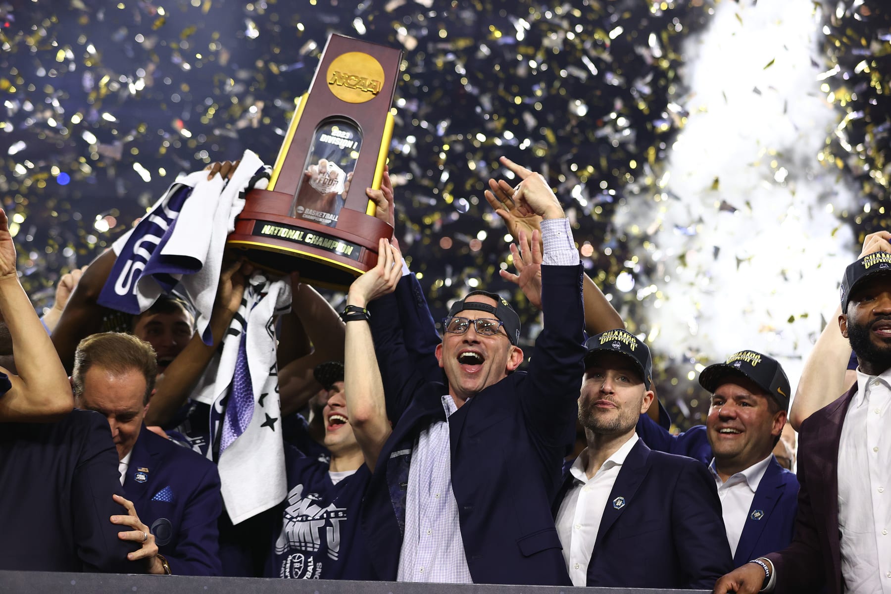 HOUSTON, TEXAS - APRIL 03: Head coach Dan Hurley of the Connecticut Huskies celebrates with the trophy after defeating the San Diego State Aztecs to win the NCAA Men's Basketball Tournament National Championship game at NRG Stadium on April 03, 2023 in Houston, Texas. (Photo by Jamie Schwaberow/NCAA Photos via Getty Images)