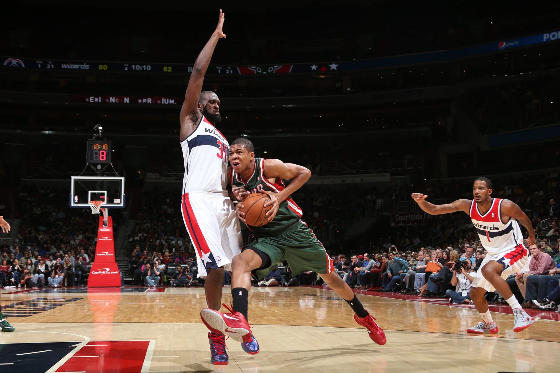 WASHINGTON, DC - DECEMBER 6: Giannis Antetokounmpo #34 of the Milwaukee Bucks drives to the basket against Chris Singleton #31 of the Washington Wizards during the game at the Verizon Center on December 6, 2013 in Washington, DC. NOTE TO USER: User expressly acknowledges and agrees that, by downloading and or using this photograph, User is consenting to the terms and conditions of the Getty Images License Agreement. Mandatory Copyright Notice: Copyright 2013 NBAE (Photo by Ned Dishman/NBAE via Getty Images)