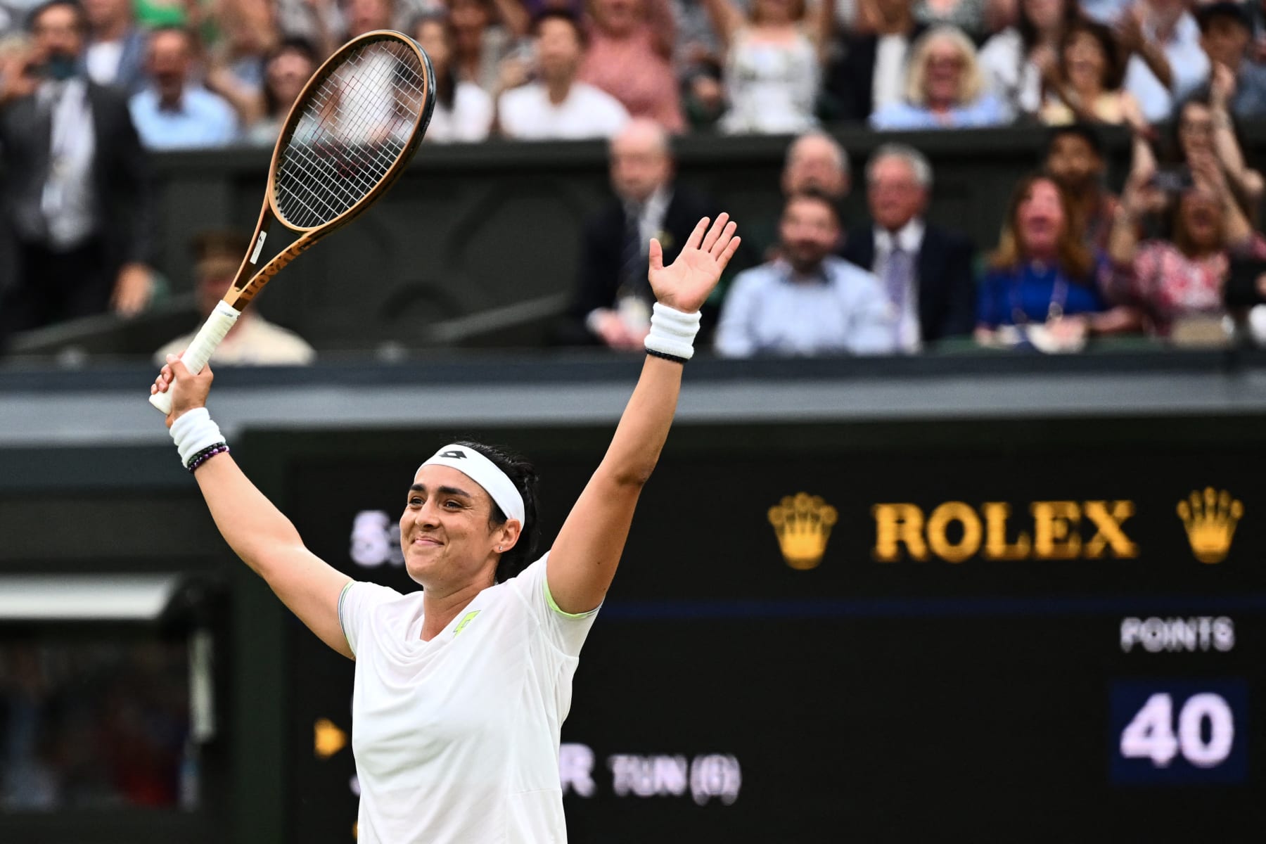 TOPSHOT - Tunisia's Ons Jabeur celebrates winning against Belarus's Aryna Sabalenka during their women's singles semi-finals tennis match on the eleventh day of the 2023 Wimbledon Championships at The All England Lawn Tennis Club in Wimbledon, southwest London, on July 13, 2023. (Photo by SEBASTIEN BOZON / AFP) / RESTRICTED TO EDITORIAL USE (Photo by SEBASTIEN BOZON/AFP via Getty Images)