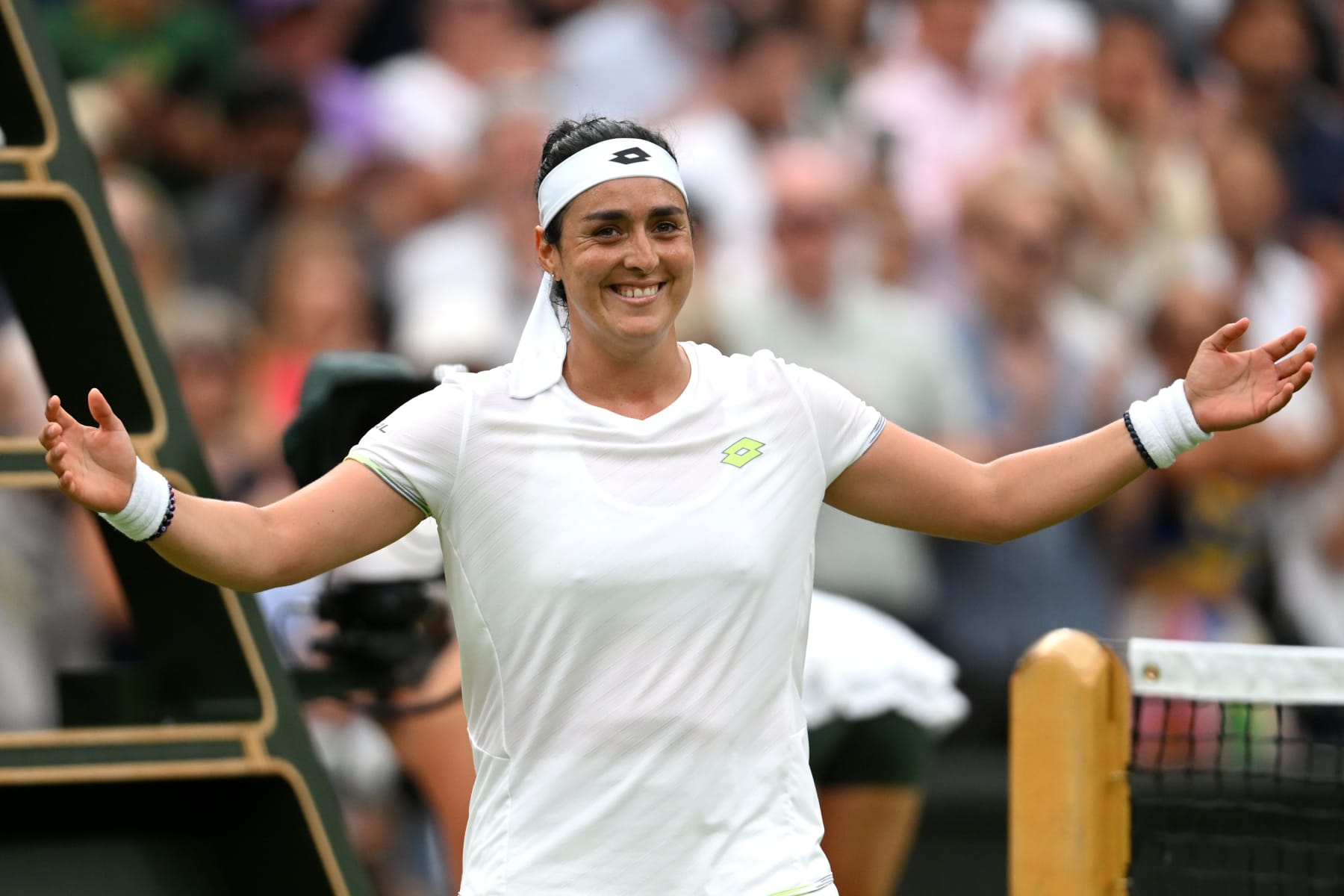 LONDON, ENGLAND - JULY 13: Ons Jabeur of Tunisia celebrates victory against Aryna Sabalenka following the Women's Singles Semi Finals on day eleven of The Championships Wimbledon 2023 at All England Lawn Tennis and Croquet Club on July 13, 2023 in London, England. (Photo by Mike Hewitt/Getty Images)