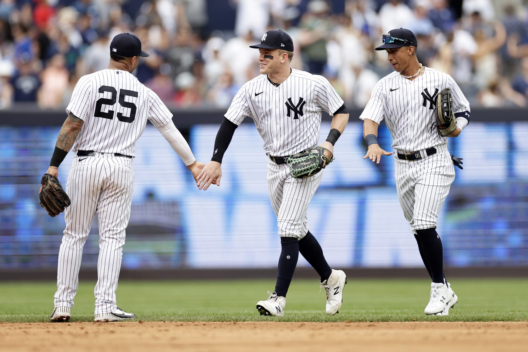 New York Yankees center fielder Harrison Bader, center, celebrates with Gleyber Torres (25) after a baseball game against the Chicago Cubs, Saturday, July 8, 2023, in New York. The Yankees won 6-3. (AP Photo/Adam Hunger)