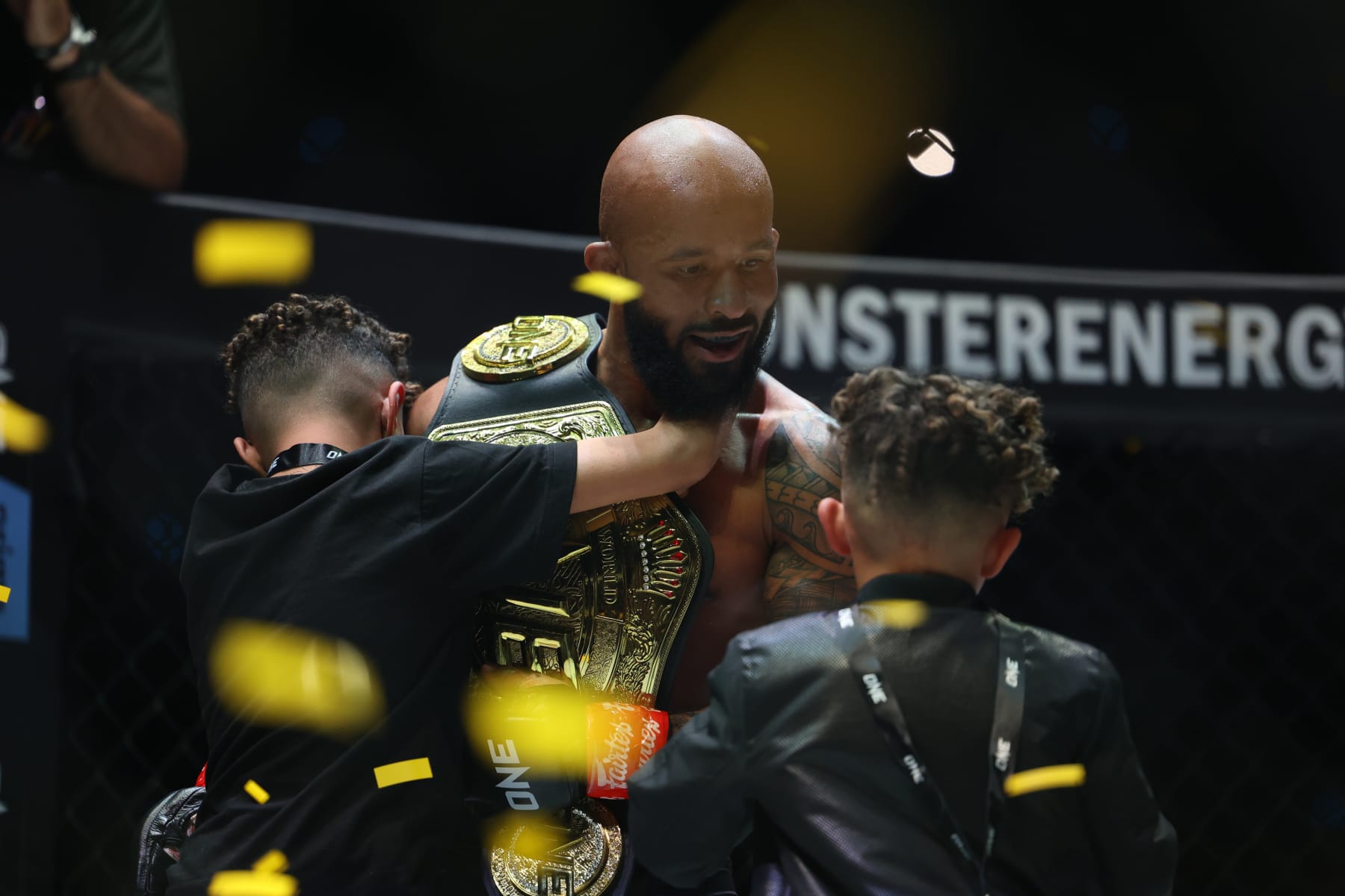 Demetrious Johnson celebrates his second win over Adriano Moraes with his sons. 