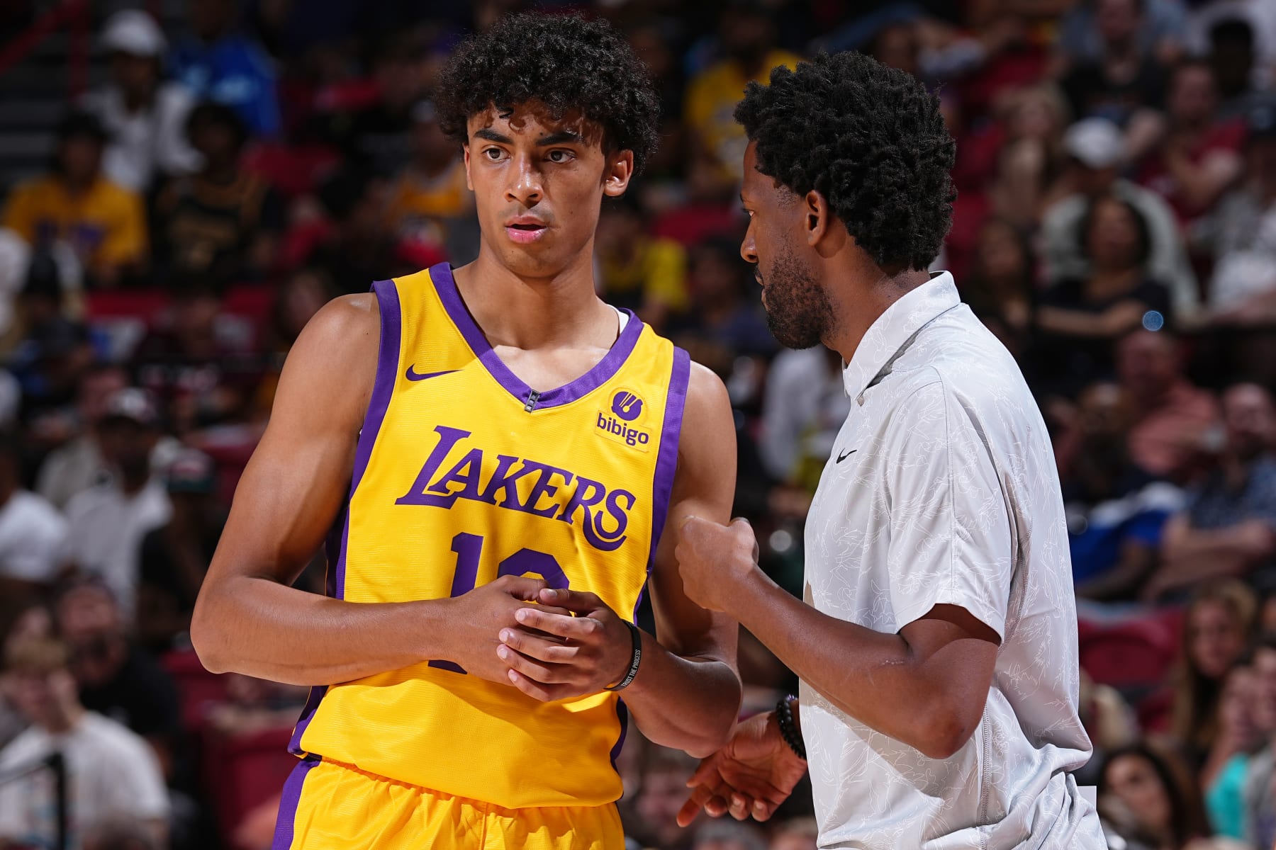 LAS VEGAS, NV - JULY 9: Head Coach JD DuBois speaks with Max Christie #10 of the Los Angeles Lakers during the game against the Charlotte Hornets during the 2023 NBA Las Vegas Summer League on July 9, 2023 at the Thomas & Mack Center in Las Vegas, Nevada. NOTE TO USER: User expressly acknowledges and agrees that, by downloading and or using this photograph, User is consenting to the terms and conditions of the Getty Images License Agreement. Mandatory Copyright Notice: Copyright 2023 NBAE (Photo by Bart Young/NBAE via Getty Images)