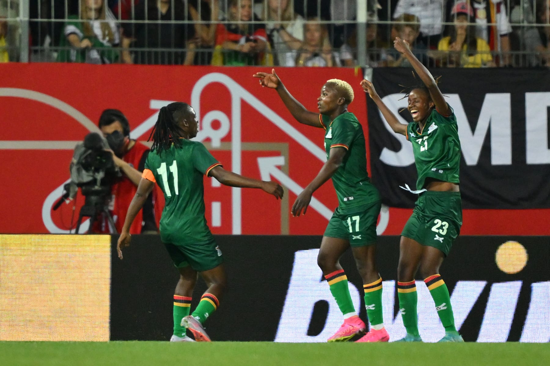 Zambian players celebrate a goal against Germany in a recent friendly. 