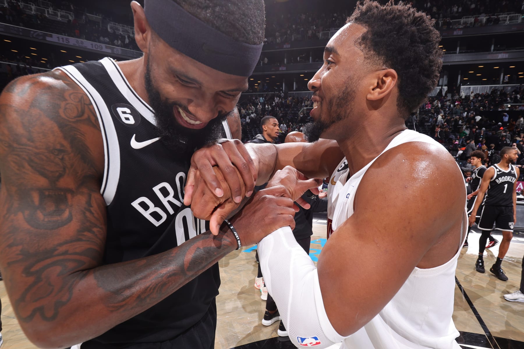 BROOKLYN, NY - MARCH 21: Royce O'Neale #00 of the Brooklyn Nets talks with Donovan Mitchell #45 of the Cleveland Cavaliers after the game on March 21, 2023 at Barclays Center in Brooklyn, New York. NOTE TO USER: User expressly acknowledges and agrees that, by downloading and or using this Photograph, user is consenting to the terms and conditions of the Getty Images License Agreement. Mandatory Copyright Notice: Copyright 2023 NBAE (Photo by Nathaniel S. Butler/NBAE via Getty Images)