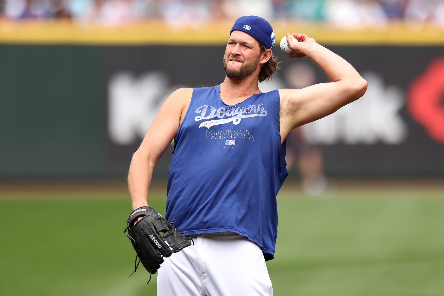SEATTLE, WASHINGTON - JULY 10: Clayton Kershaw #22 of the Los Angeles Dodgers throws the ball during Gatorade All-Star Workout Day at T-Mobile Park on July 10, 2023 in Seattle, Washington. (Photo by Tim Nwachukwu/Getty Images)