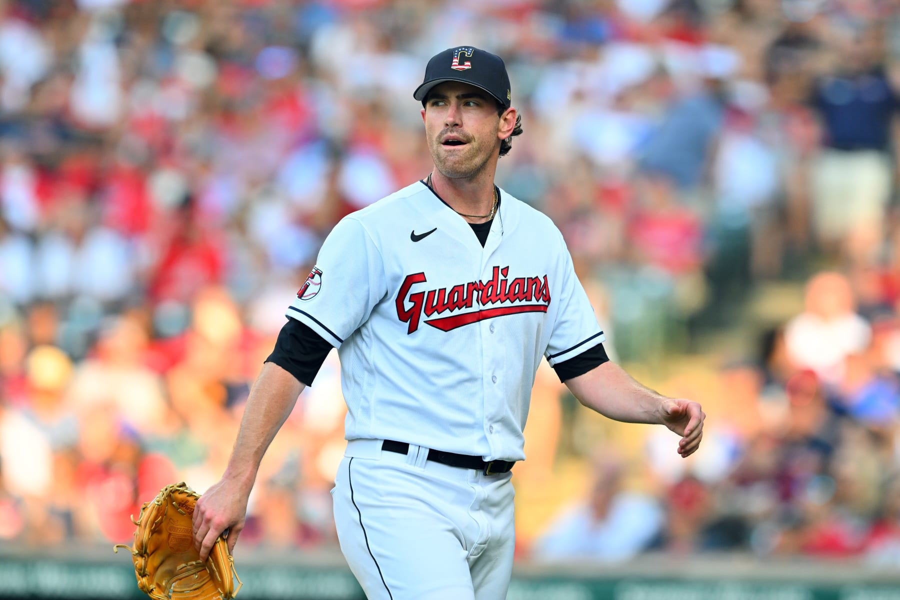CLEVELAND, OHIO - JULY 04: Starting pitcher Shane Bieber #57 of the Cleveland Guardians reacts as he walks off the field after the top of the first inning against the Atlanta Braves at Progressive Field on July 04, 2023 in Cleveland, Ohio. The Guardians defeated the Braves 6-5 in the 10th inning. (Photo by Jason Miller/Getty Images)