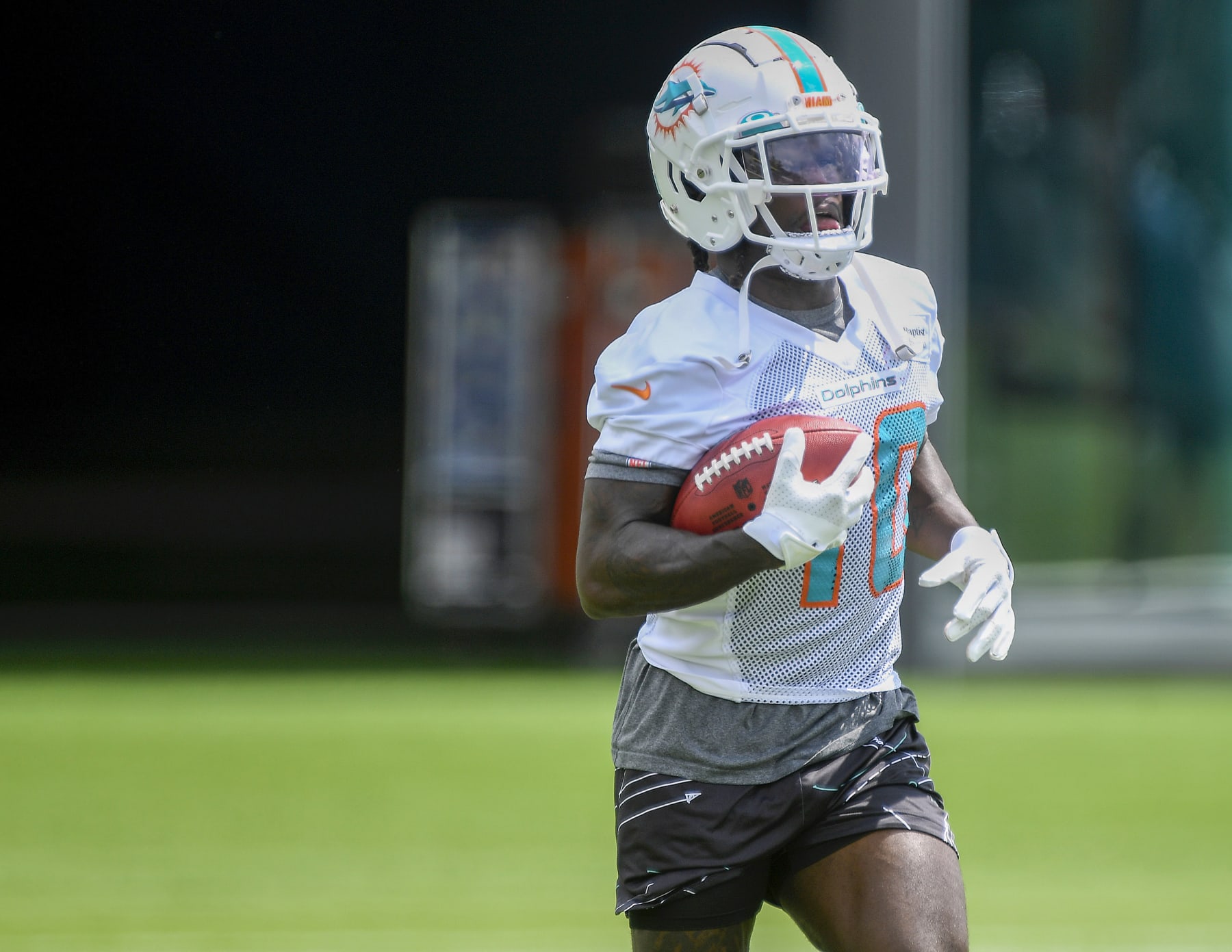 Miami Dolphins wide receiver Tyreek Hill runs a drill during practice at the NFL football team's training facility, Wednesday, June 7, 2023, in Miami Gardens, Fla. (AP Photo/Michael Laughlin)