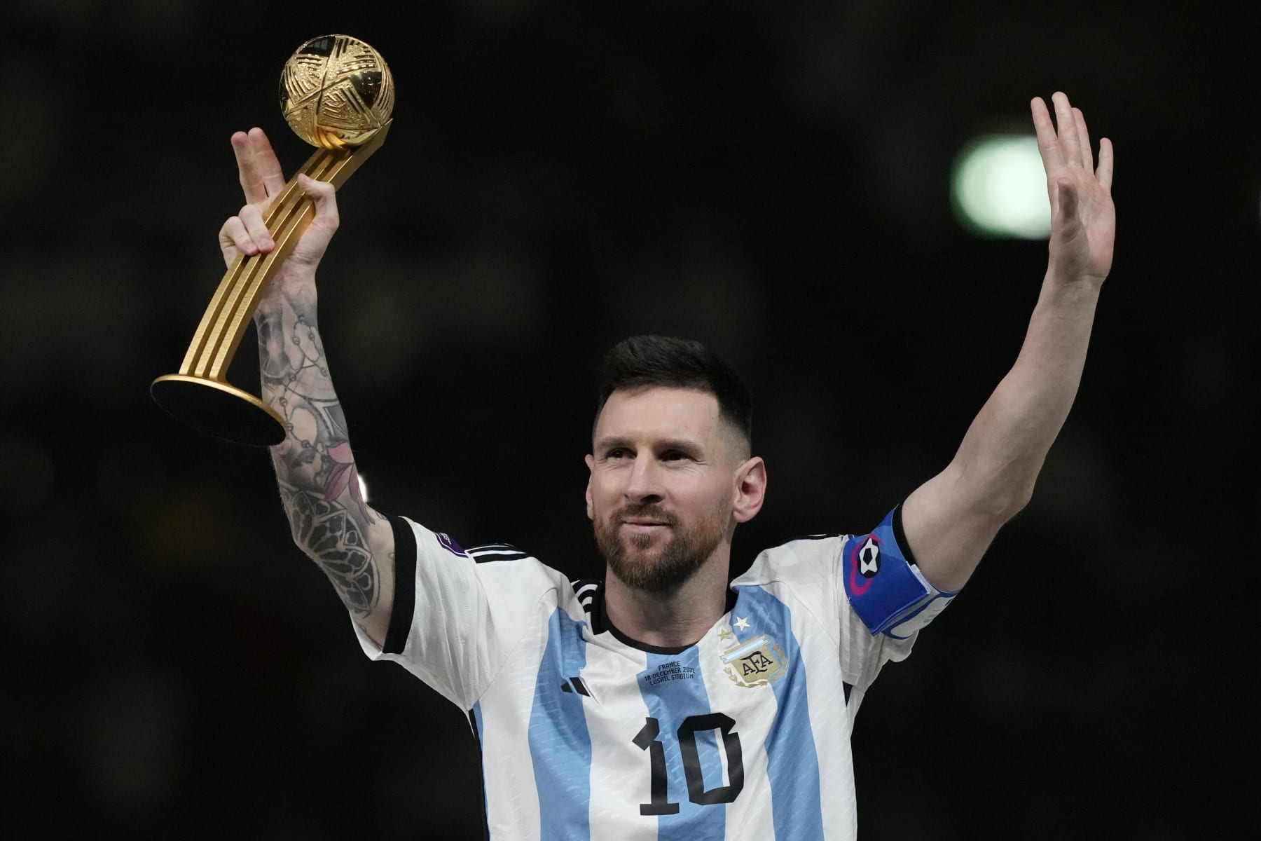 FILE - Argentina's Lionel Messi waves after receiving the Golden Ball award for best player of the tournament at the end of the World Cup final soccer match between Argentina and France at the Lusail Stadium in Lusail, Qatar, Sunday, Dec. 18, 2022. Lionel Messi says he is coming to Inter Miami and joining Major League Soccer. After months of speculation, Messi announced his decision Wednesday, June 7, 2023,to join a Miami franchise that has been led by another global soccer icon in David Beckham since its inception but has yet to make any real splashes on the field.(AP Photo/Martin Meissner, File)