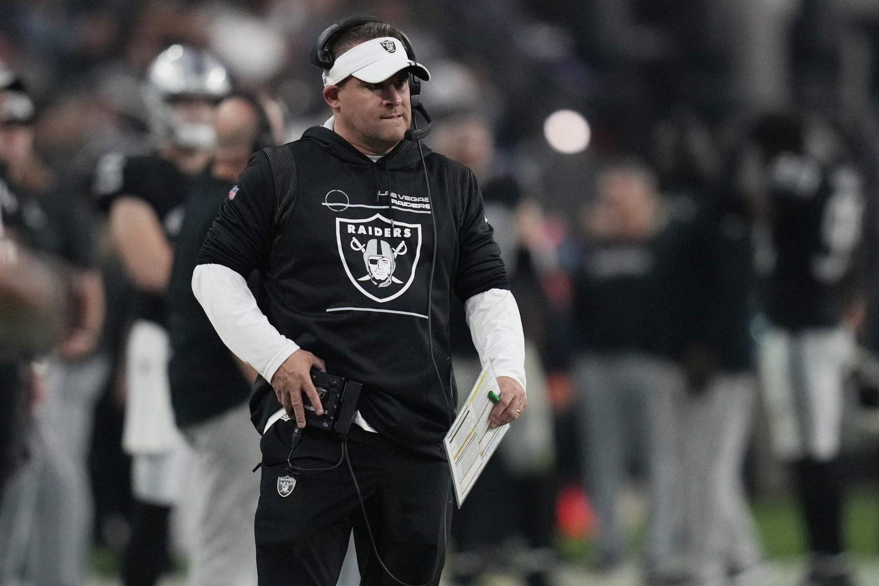 Las Vegas Raiders head coach Josh McDaniels stands on the sidelines during the second half of an NFL football game against the Kansas City Chiefs, Wednesday, Jan. 11, 2023, in Las Vegas. (AP Photo/John Locher)