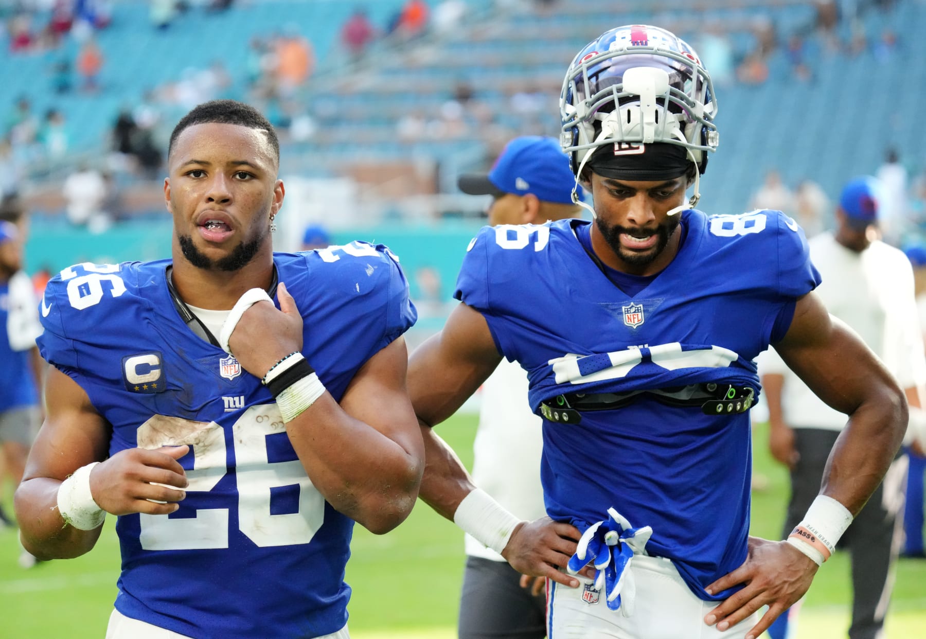 MIAMI GARDENS, FLORIDA - DECEMBER 05: Saquon Barkley #26 and Darius Slayton #86 of the New York Giants walk off the field after the game against the Miami Dolphins at Hard Rock Stadium on December 05, 2021 in Miami Gardens, Florida. (Photo by Mark Brown/Getty Images)