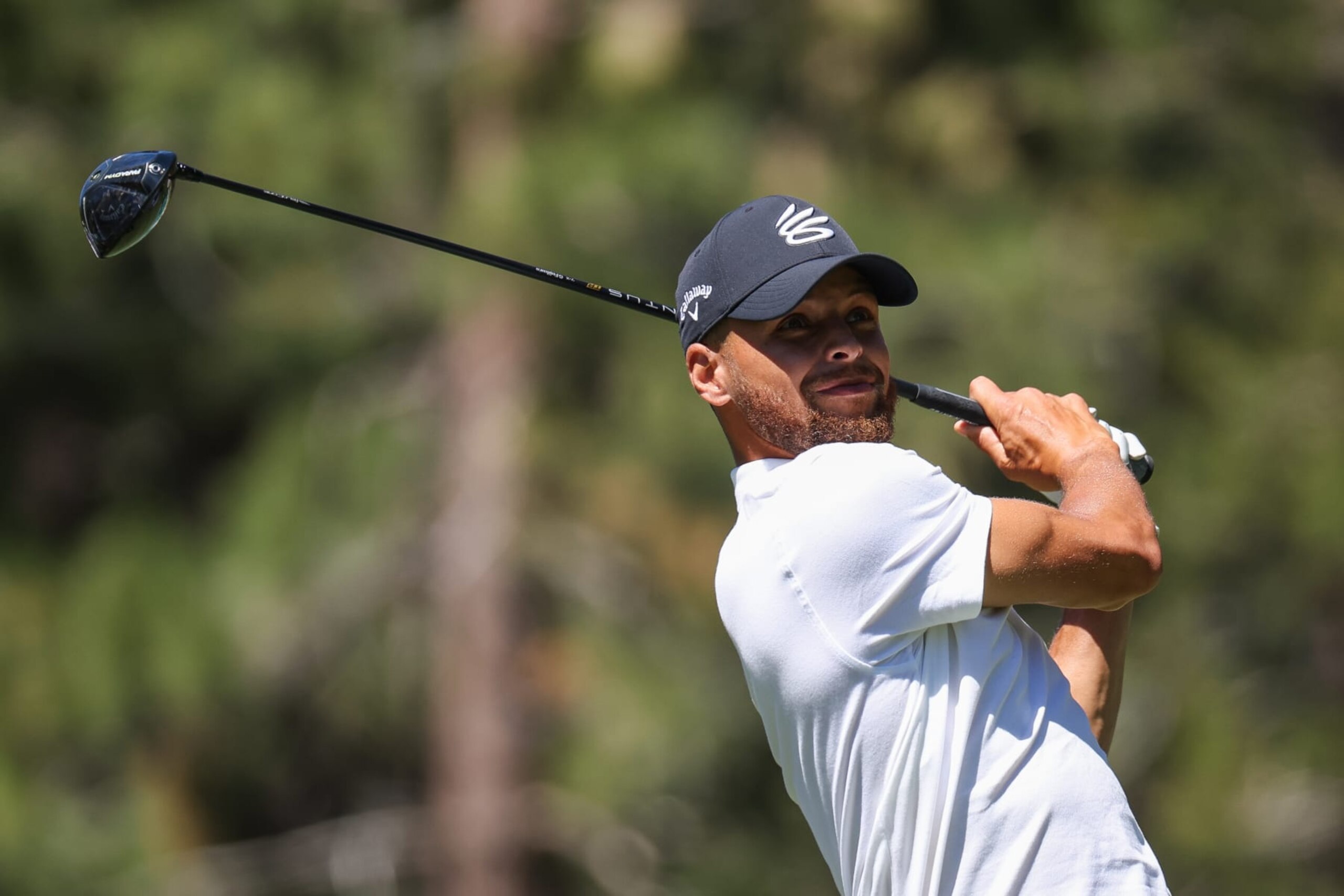 STATELINE, NEVADA - JULY 14: Stephen Curry of the NBA Golden State Warriors hits his tee on the 18th hole on Day One of the 2023 American Century Championship at Edgewood Tahoe Golf Course on July 14, 2023 in Stateline, Nevada. (Photo by Isaiah Vazquez/Getty Images)
