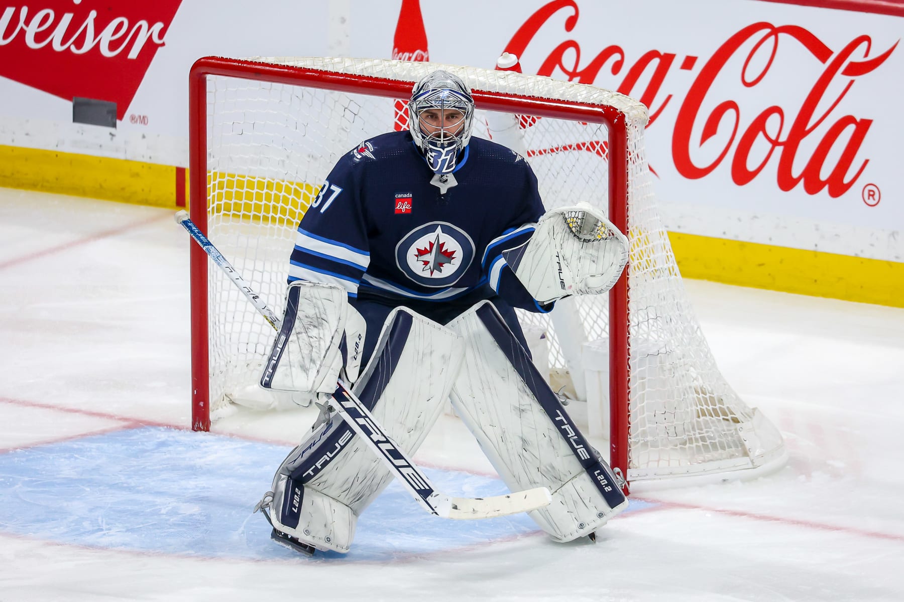 WINNIPEG, CANADA - MARCH 21: Goaltender Connor Hellebuyck #37 of the Winnipeg Jets guards the net during third period action against the Arizona Coyotes at the Canada Life Centre on March 21, 2023 in Winnipeg, Manitoba, Canada. (Photo by Jonathan Kozub/NHLI via Getty Images)