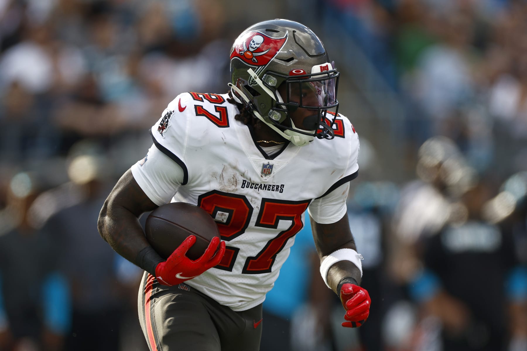 CHARLOTTE, NORTH CAROLINA - DECEMBER 26: Ronald Jones #27 of the Tampa Bay Buccaneers carries the ball during the first half of the game against the Carolina Panthers at Bank of America Stadium on December 26, 2021 in Charlotte, North Carolina. (Photo by Jared C. Tilton/Getty Images)