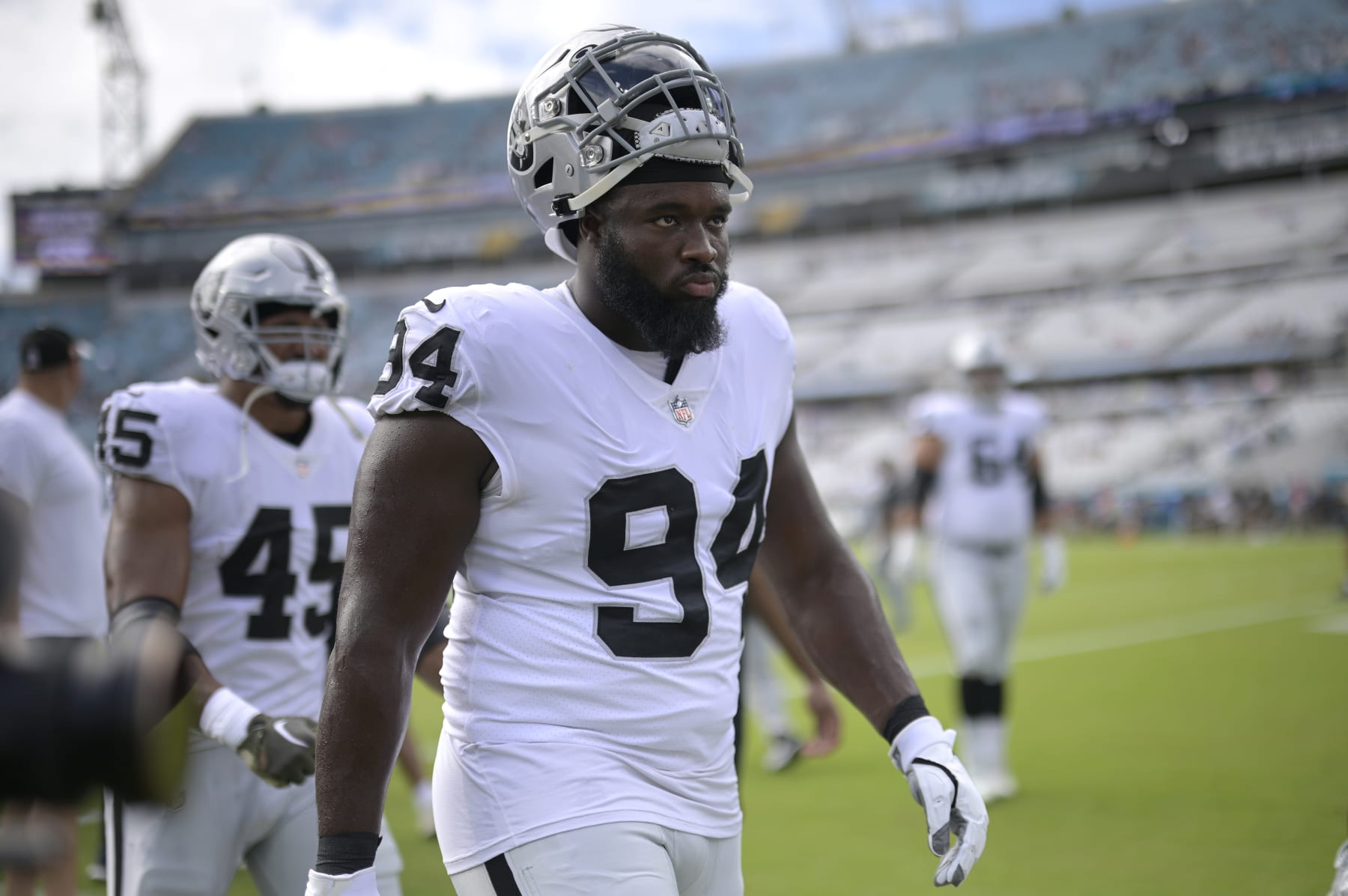 Las Vegas Raiders defensive tackle Matthew Butler (94) leaves the field after warming up before an NFL football game against the Jacksonville Jaguars, Sunday, Nov. 6, 2022, in Jacksonville, Fla. (AP Photo/Phelan M. Ebenhack)
